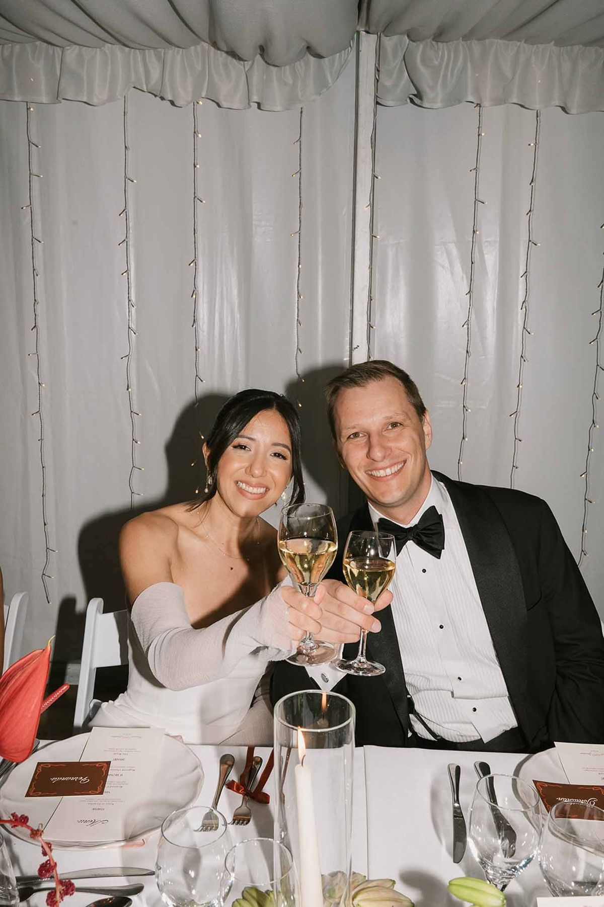 Couple toasting champagne at reception at Abbaye de Talloires