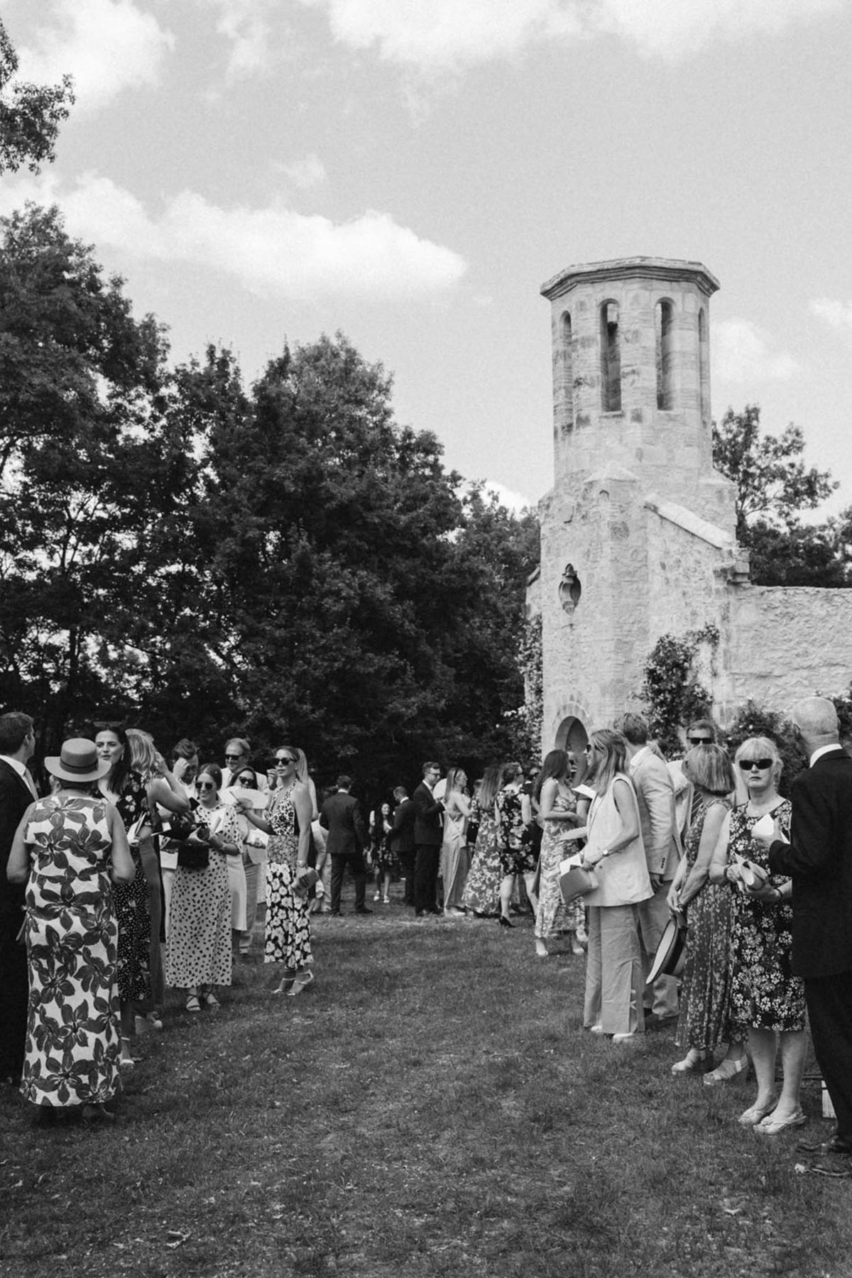 Black and white photo of wedding ceremony in a chapel