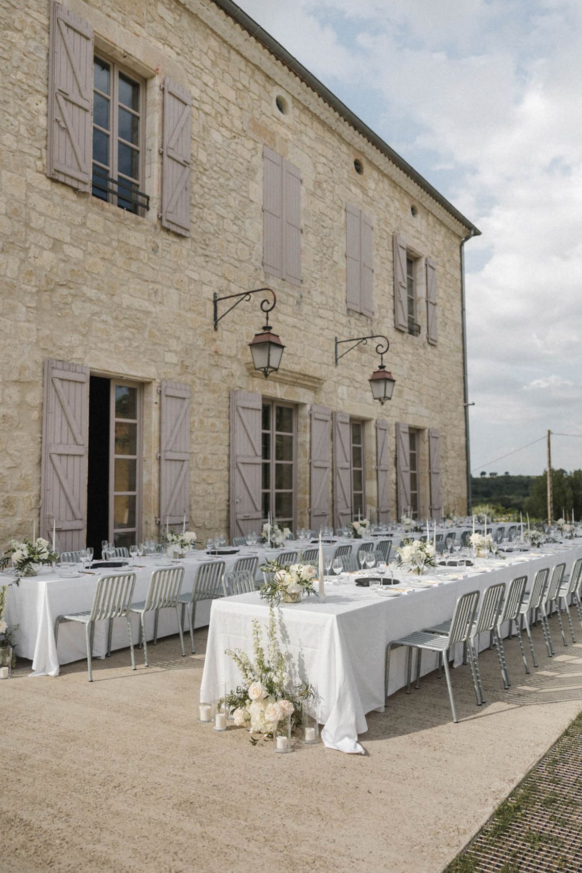 Wedding reception table setting with white roses