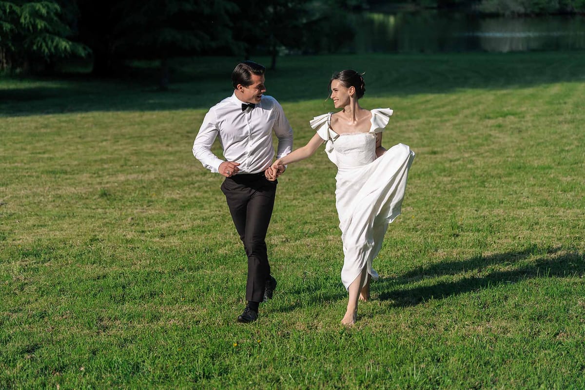 Bride and groom walking hand in hand