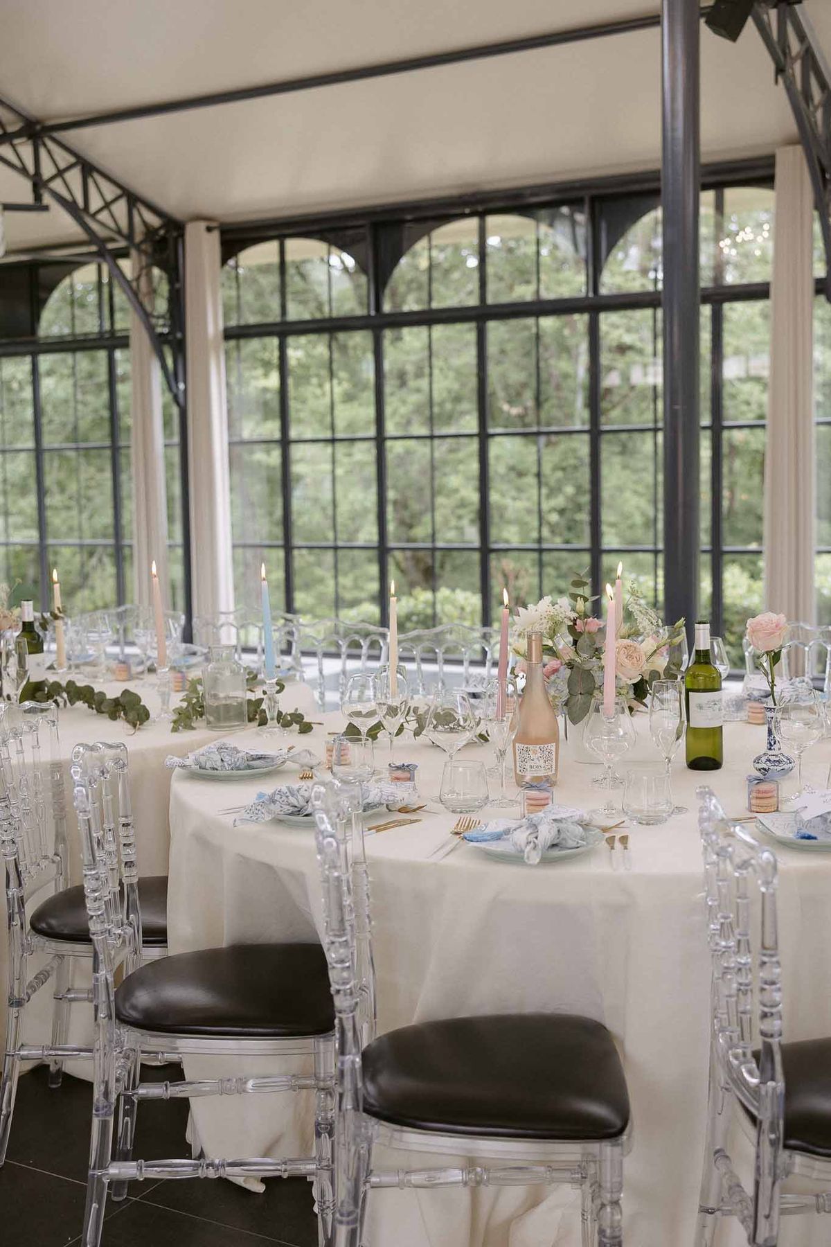 Wedding reception table setting in a garden with white roses