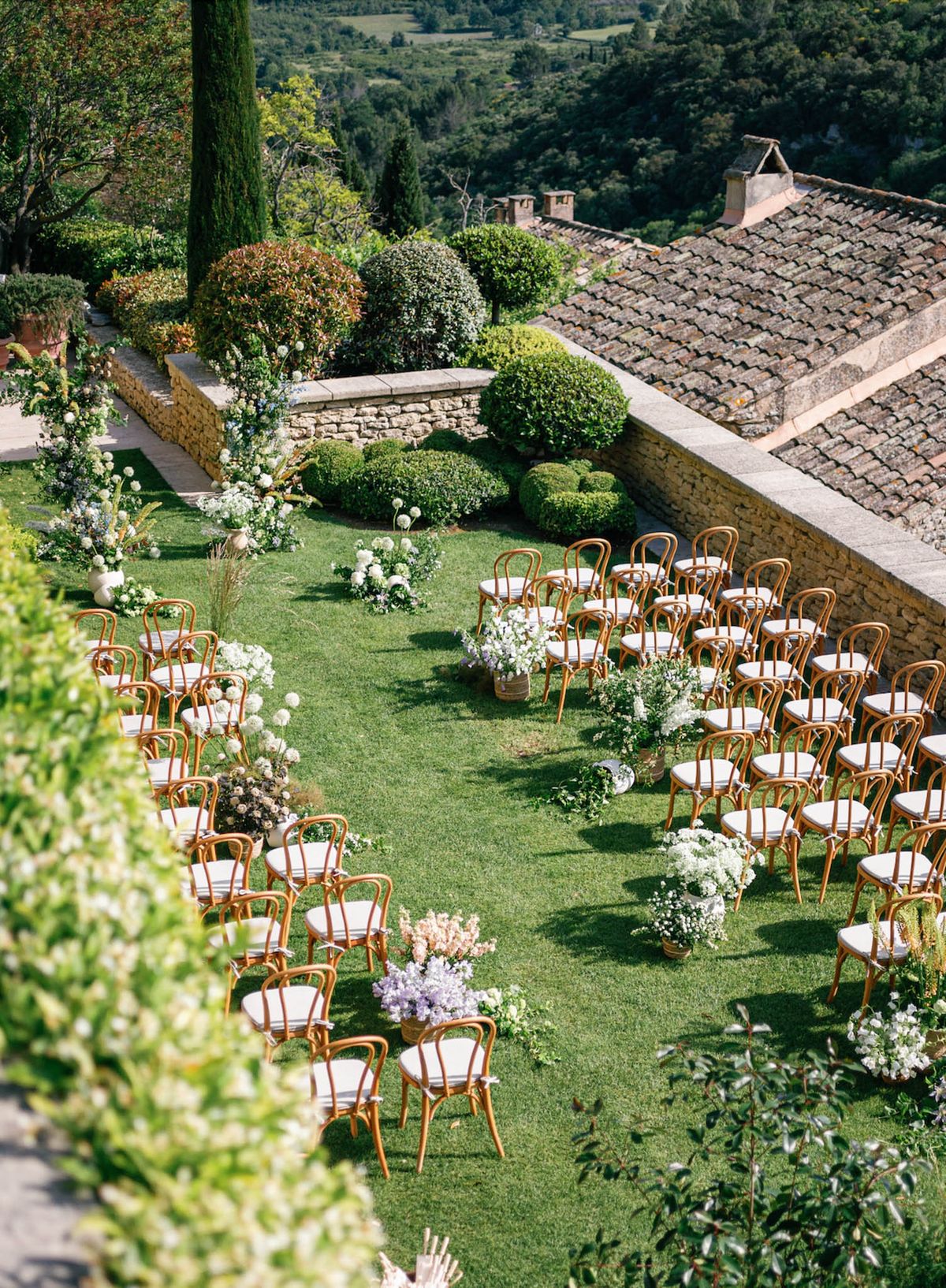 Wedding ceremony setup in a garden with white roses