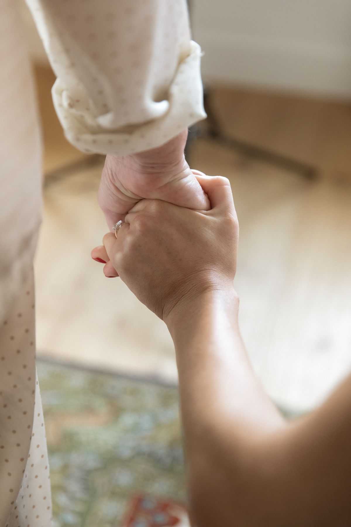 Hand-hold detail with engagement ring before the ceremony at Chateau Gassies, Nouvelle-Aquitaine