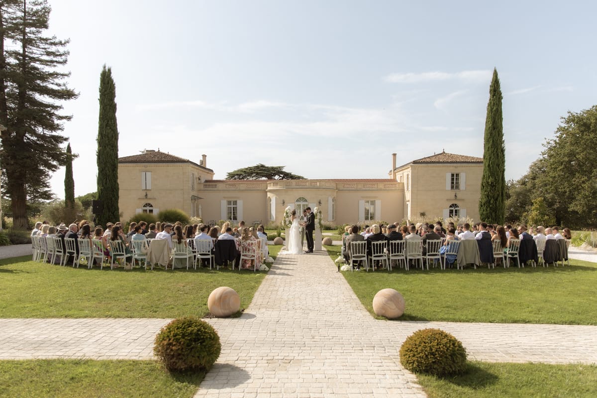Wide outdoor ceremony in front of Chateau Gassies, Nouvelle-Aquitaine