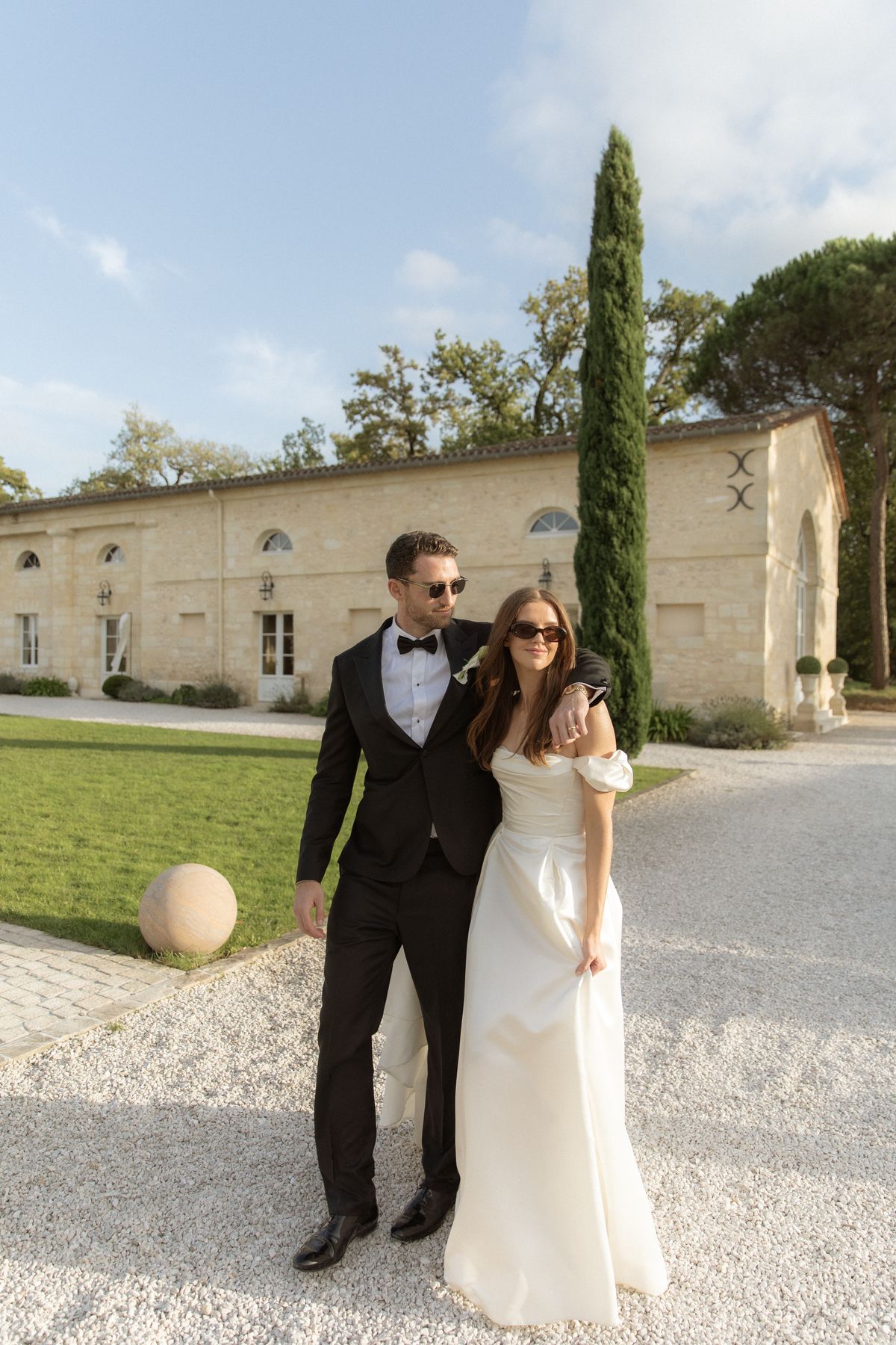 Bride and groom relaxed portrait outside Chateau Gassies, Nouvelle-Aquitaine