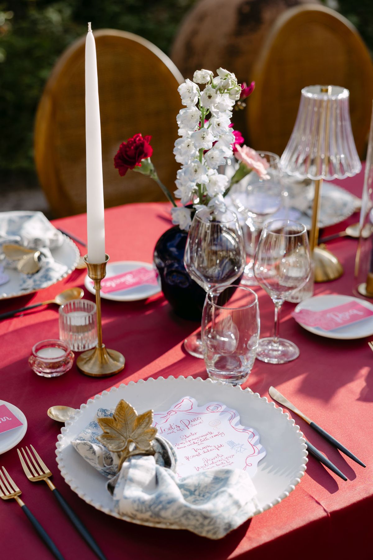 Colourful wedding details at Domaine de Perrotin in shades of fuchsia, raspberry, sky blue and orange, from the florals and tablescapes of Rooa and Mark's celebration