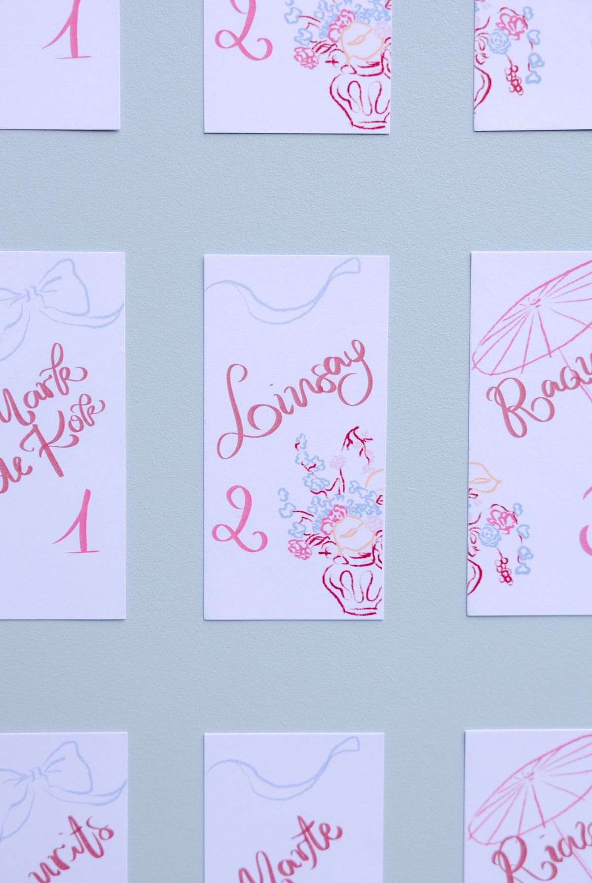 Hand-lettered stationery and styling details in fuchsia and sky blue from Rooa and Mark's wedding at Domaine de Perrotin