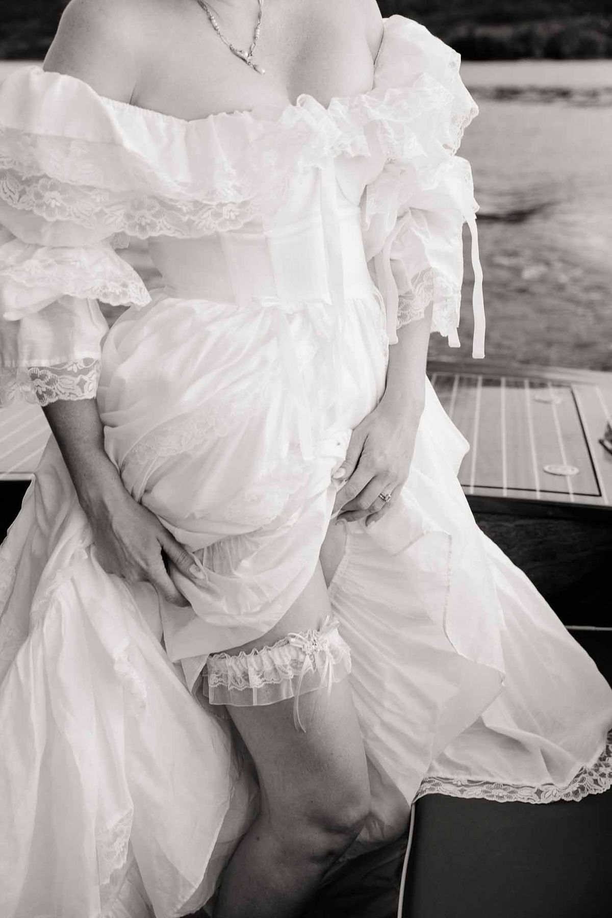 Vintage lace gown and garter detail in black and white at Palace de Menthon Annecy