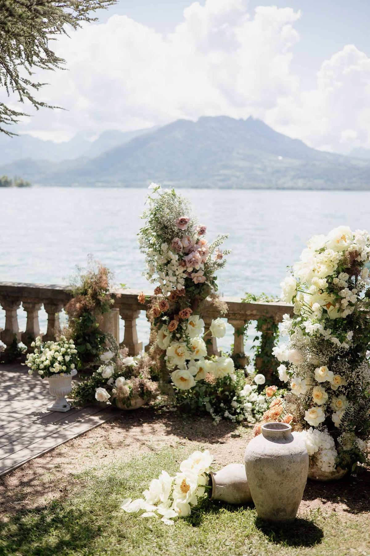 Wedding ceremony setup in a garden with white roses