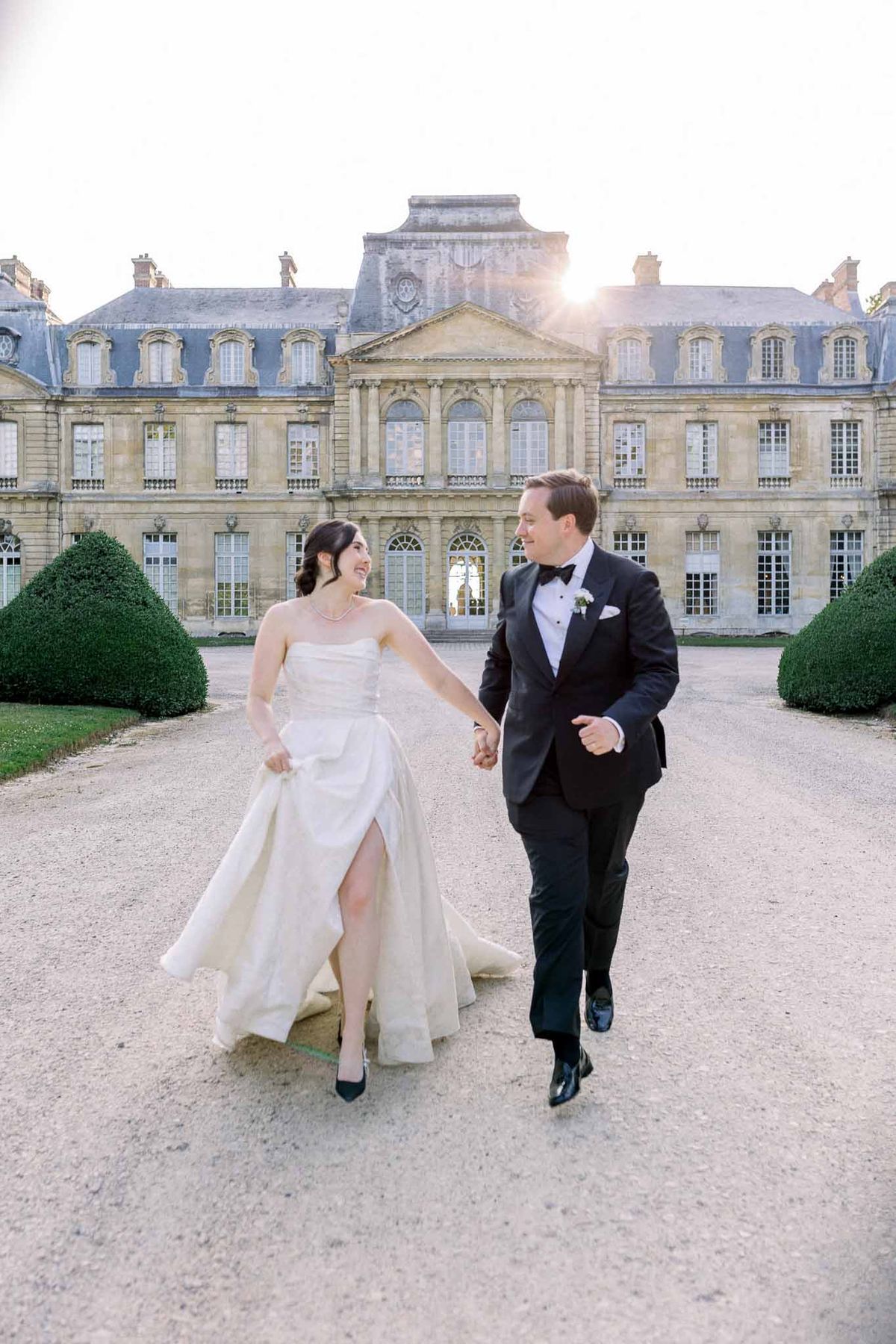 Bride and groom walking hand in hand