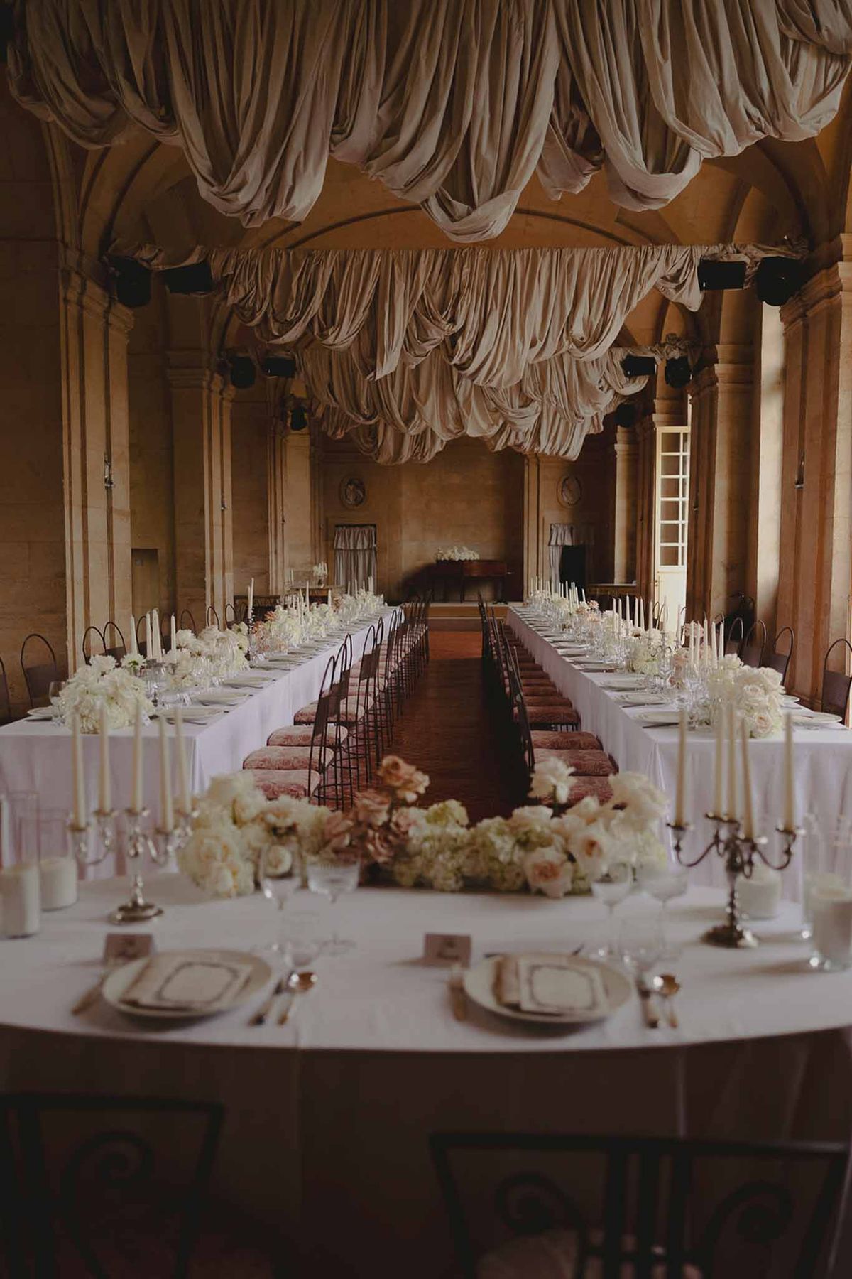 Wedding ceremony setup in a garden with white roses
