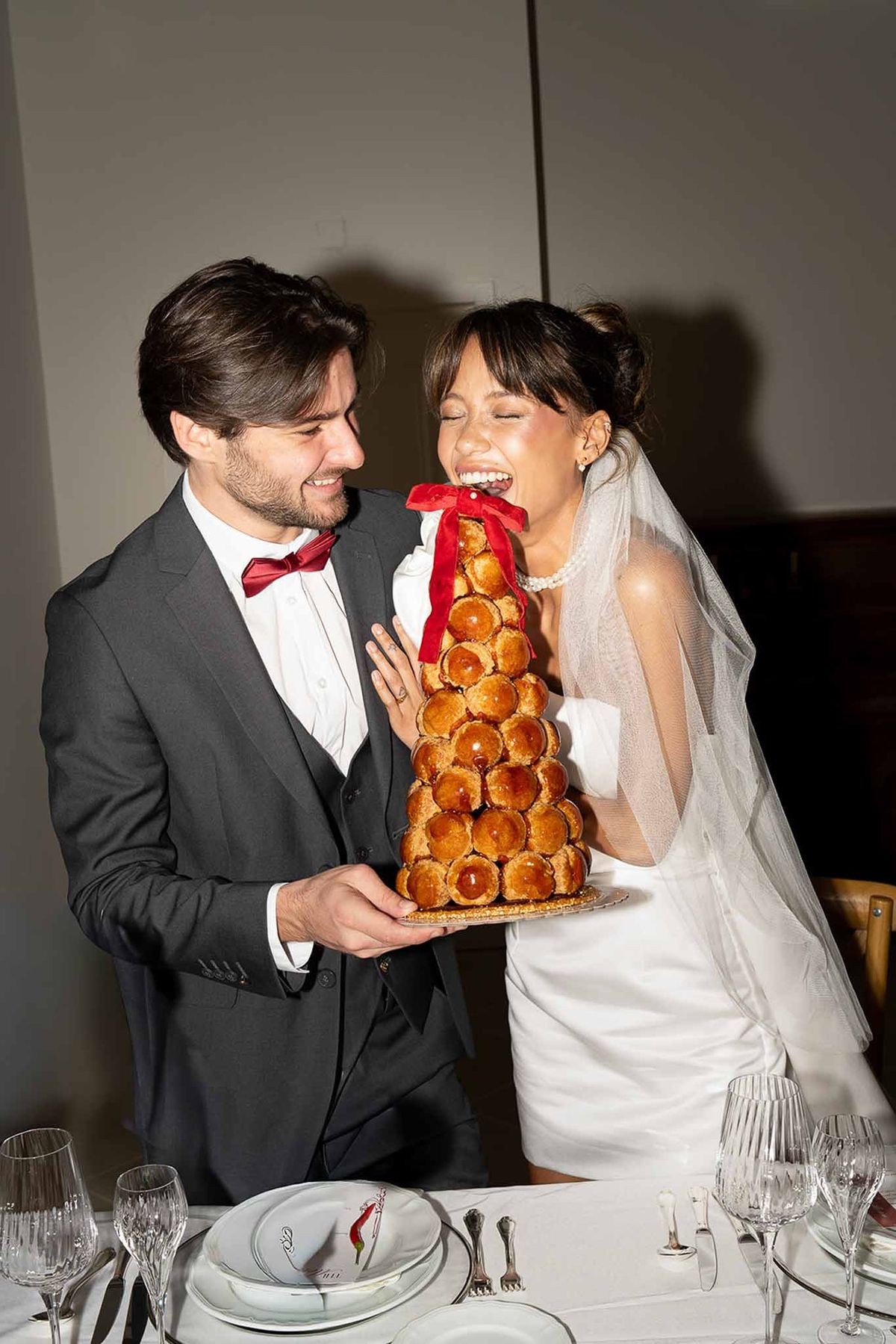 Couple eating cake together at Scarlet Hour reception