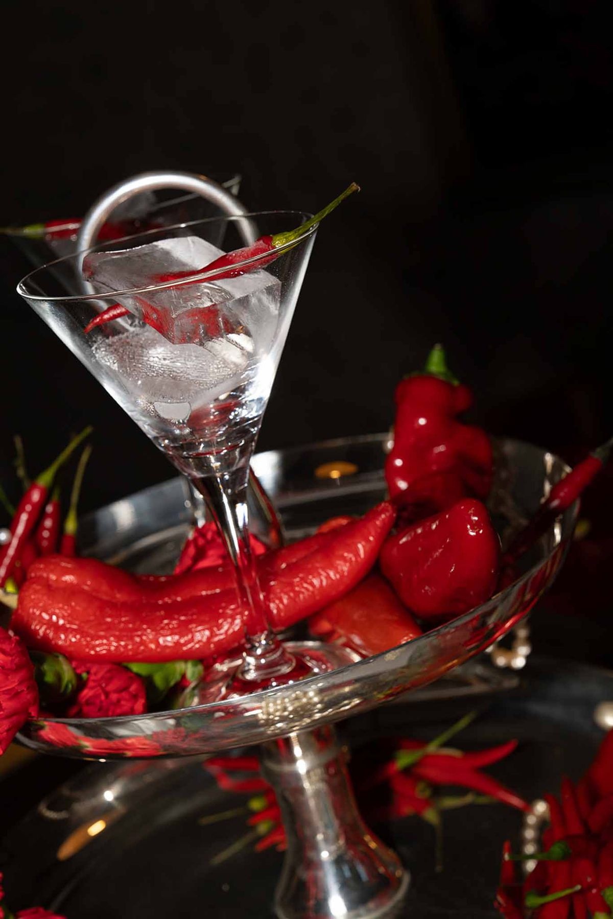 Red chilli centrepiece with champagne glass and ice