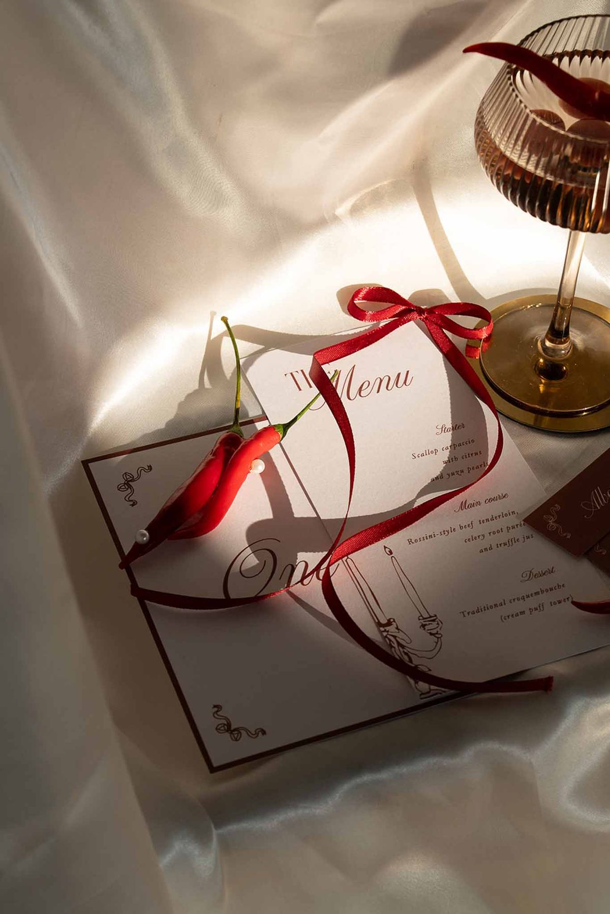 Menu card in red and white with drink and chilli detail