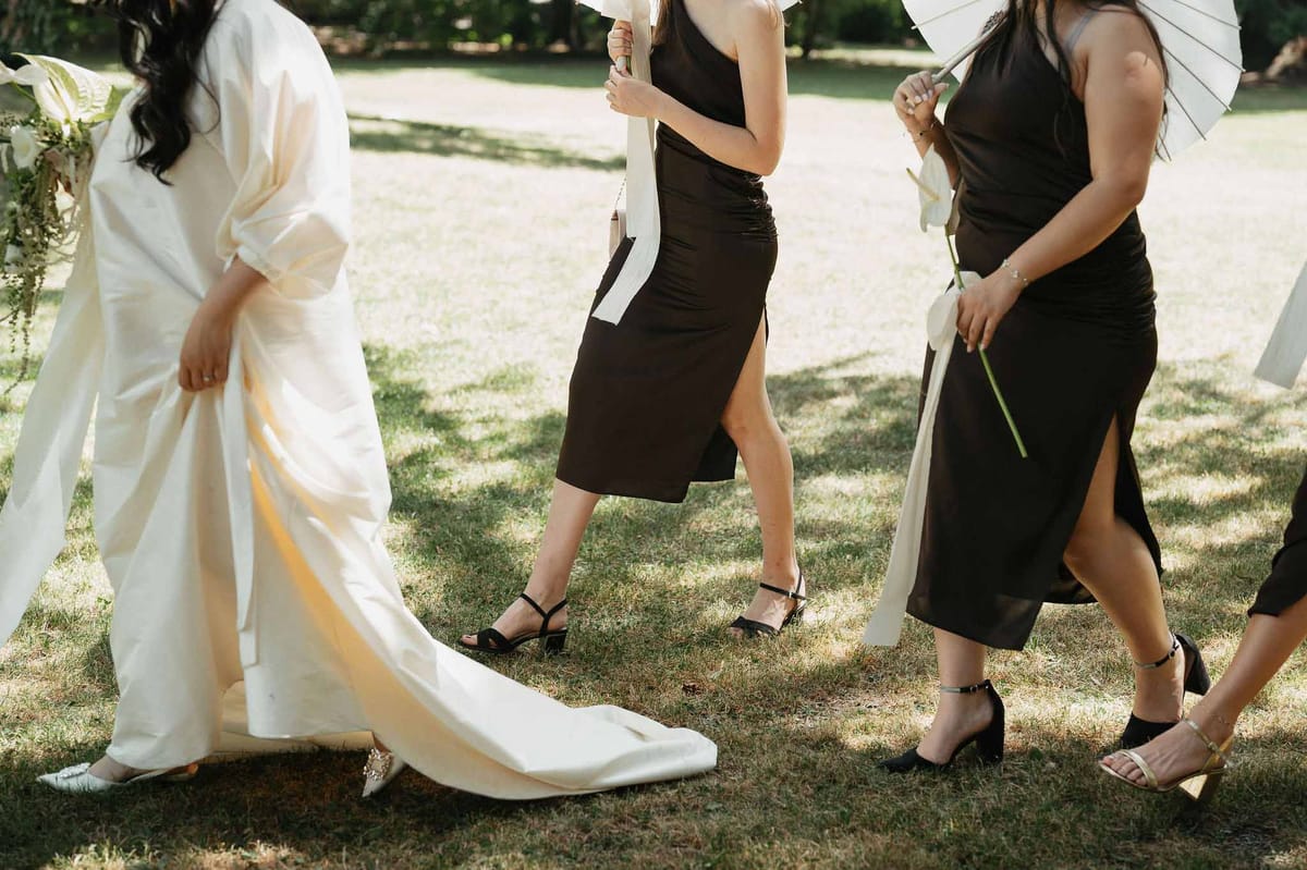 Black and white photo of bridal party in a garden
