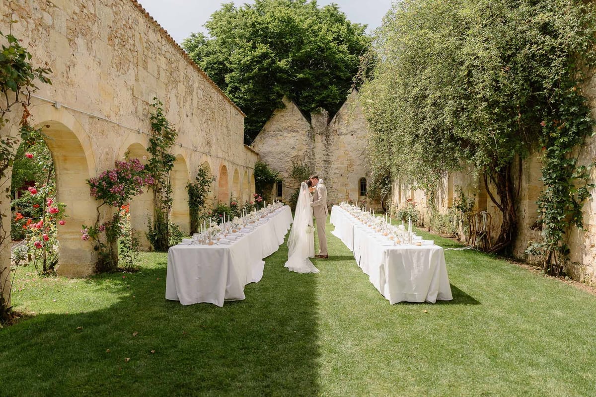 Wedding reception table setting with white roses
