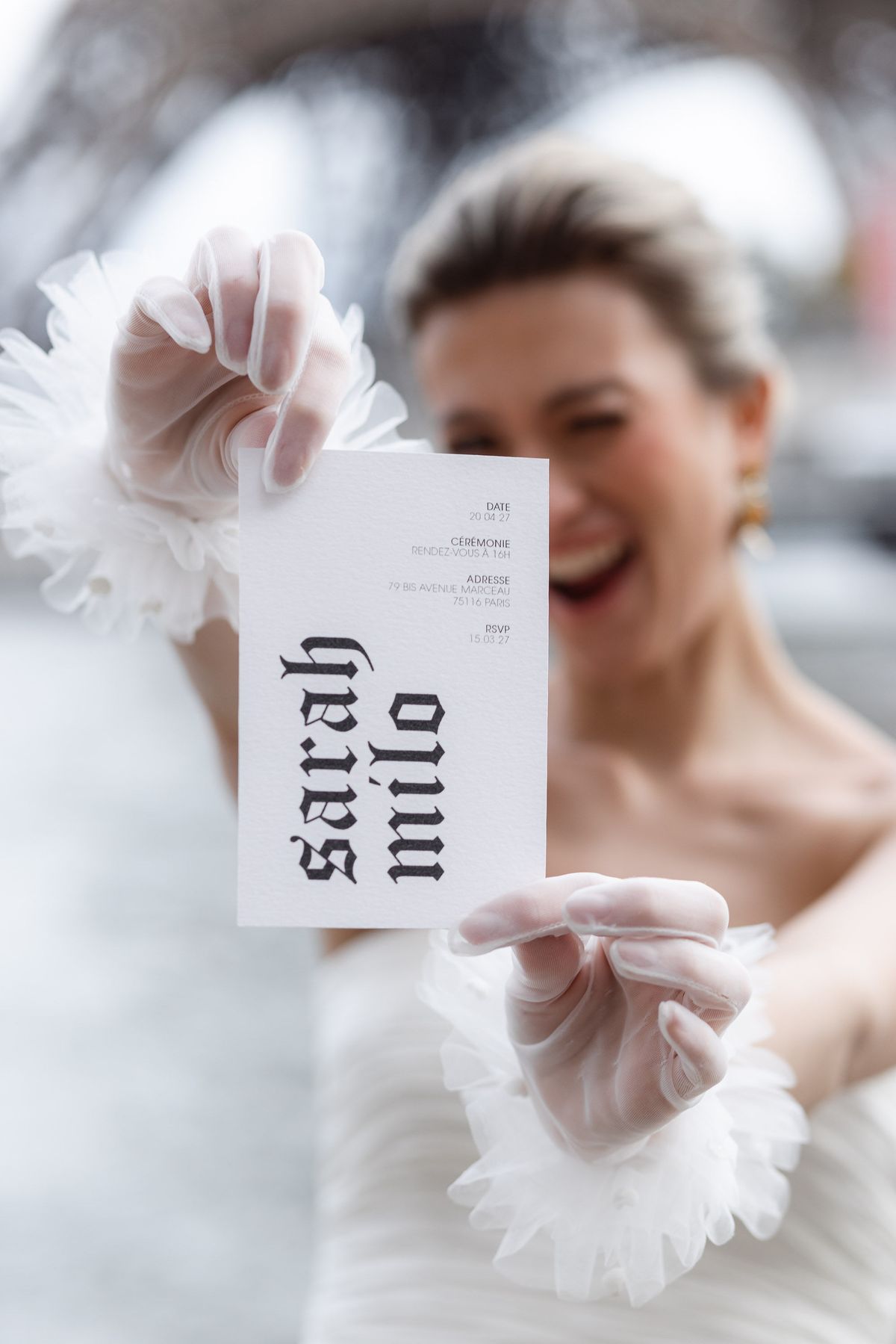 Victorian-inspired wedding menu card held in a gloved hand