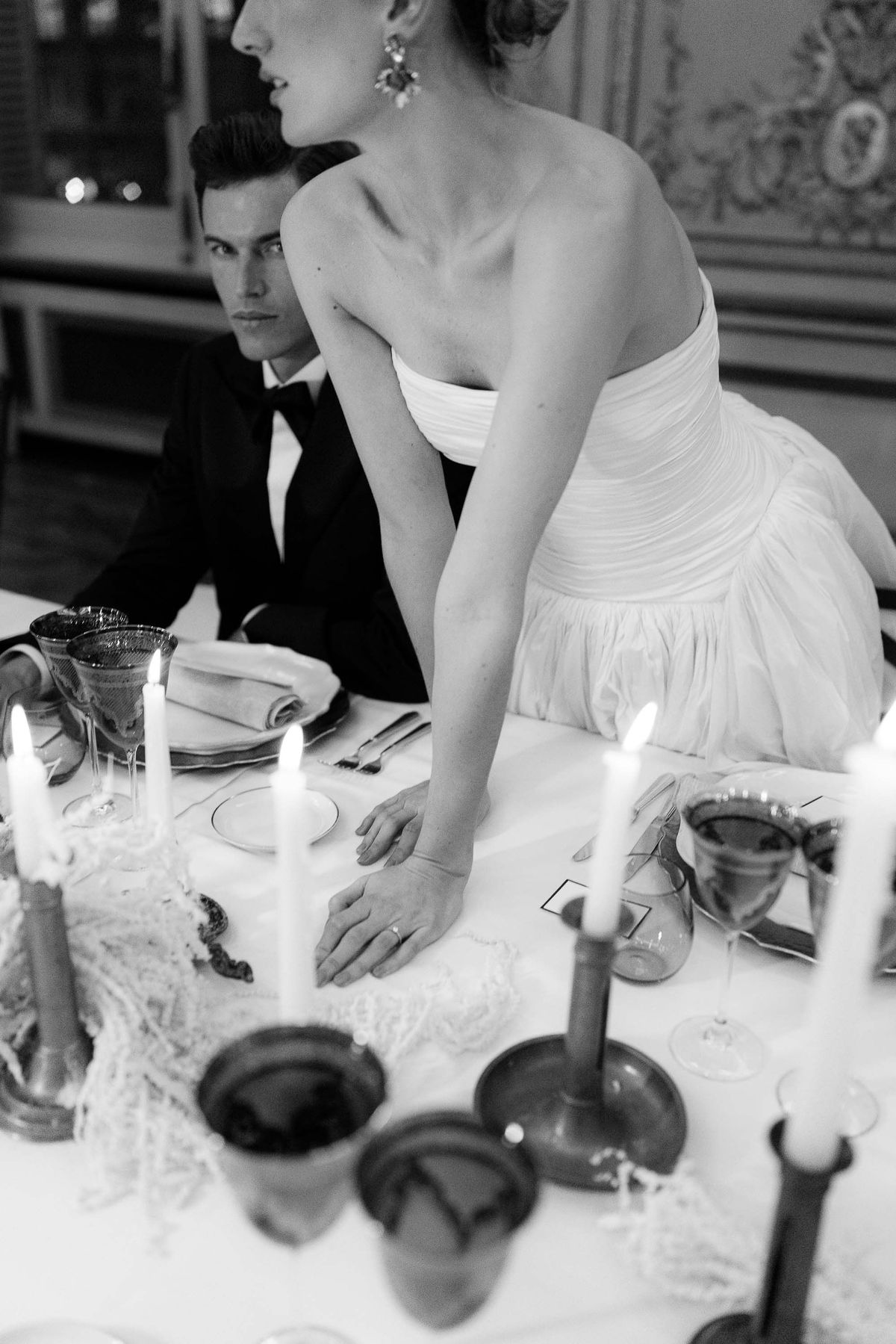 Black and white place setting with taper candles