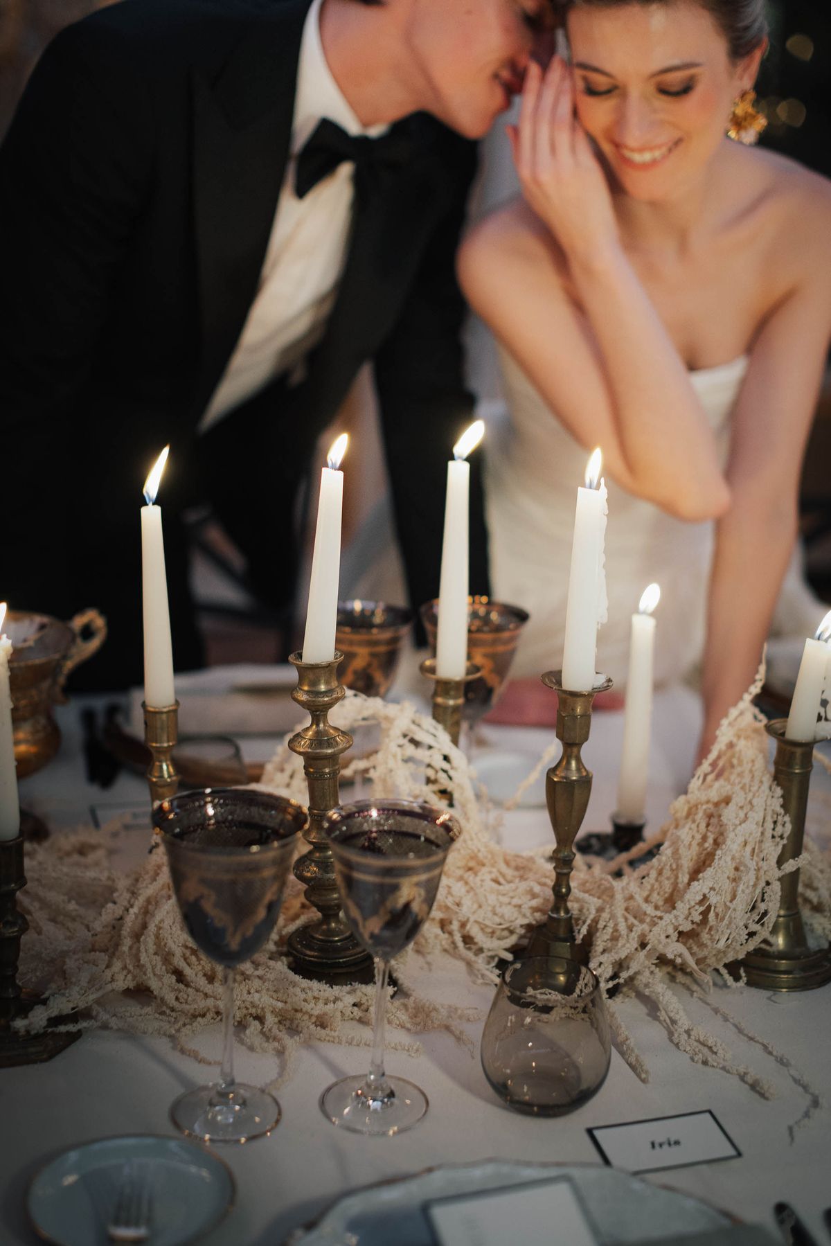 Candlelight and the bride beside the dinner table