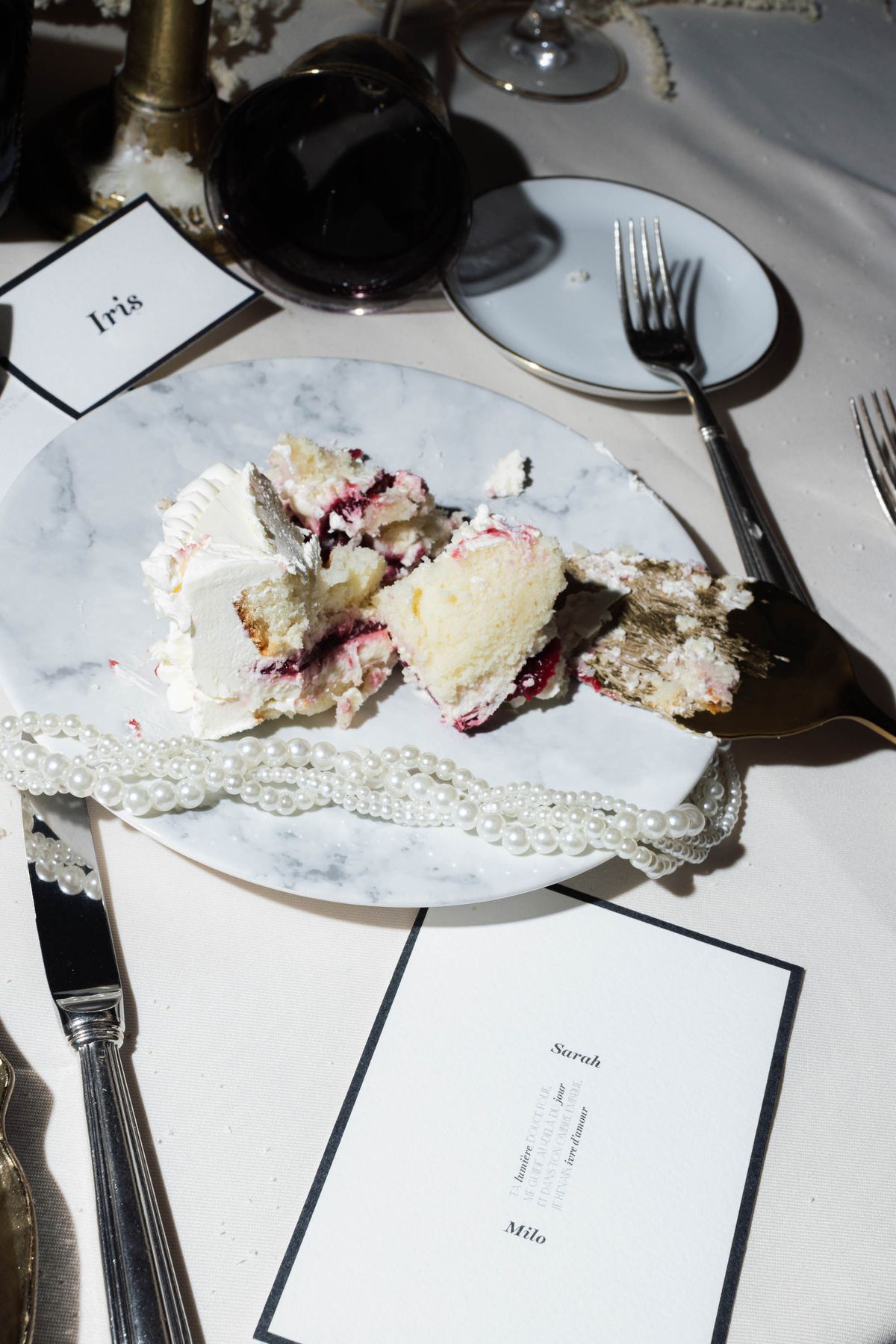 Slice of wedding cake on a marble plate