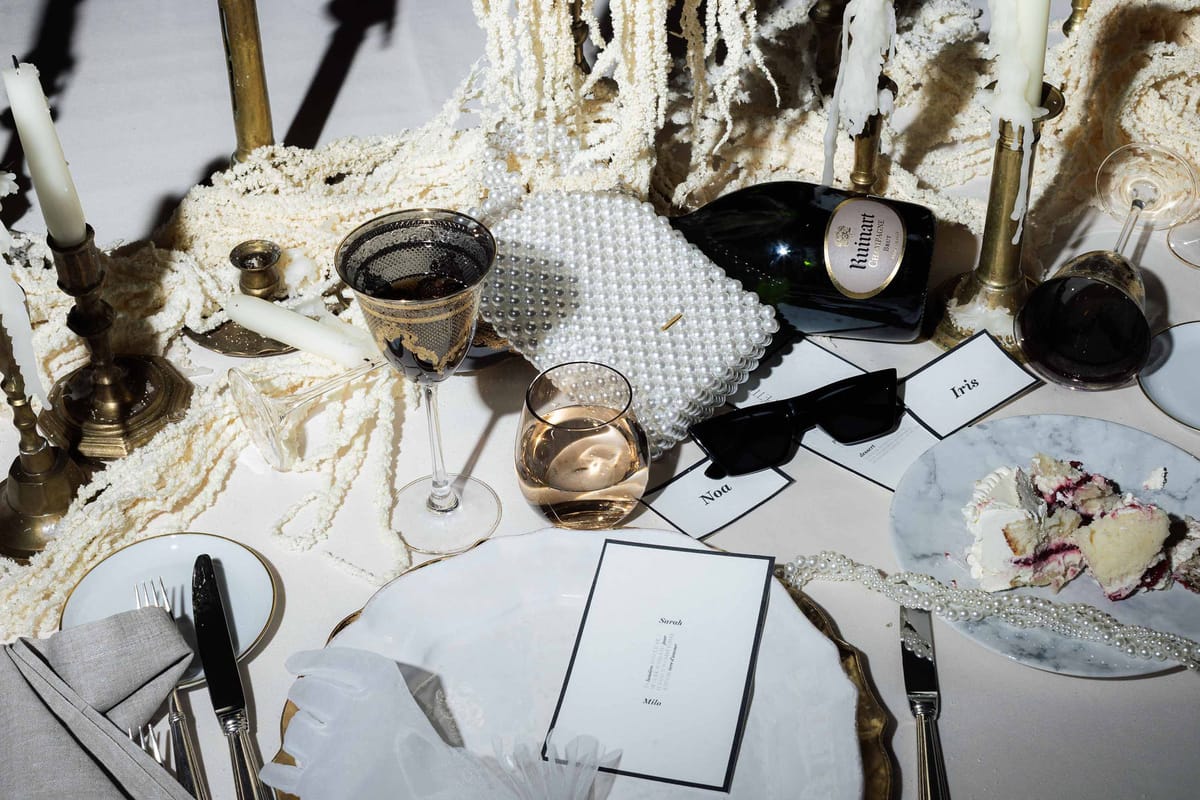 Candles, glassware and place cards on the dinner table