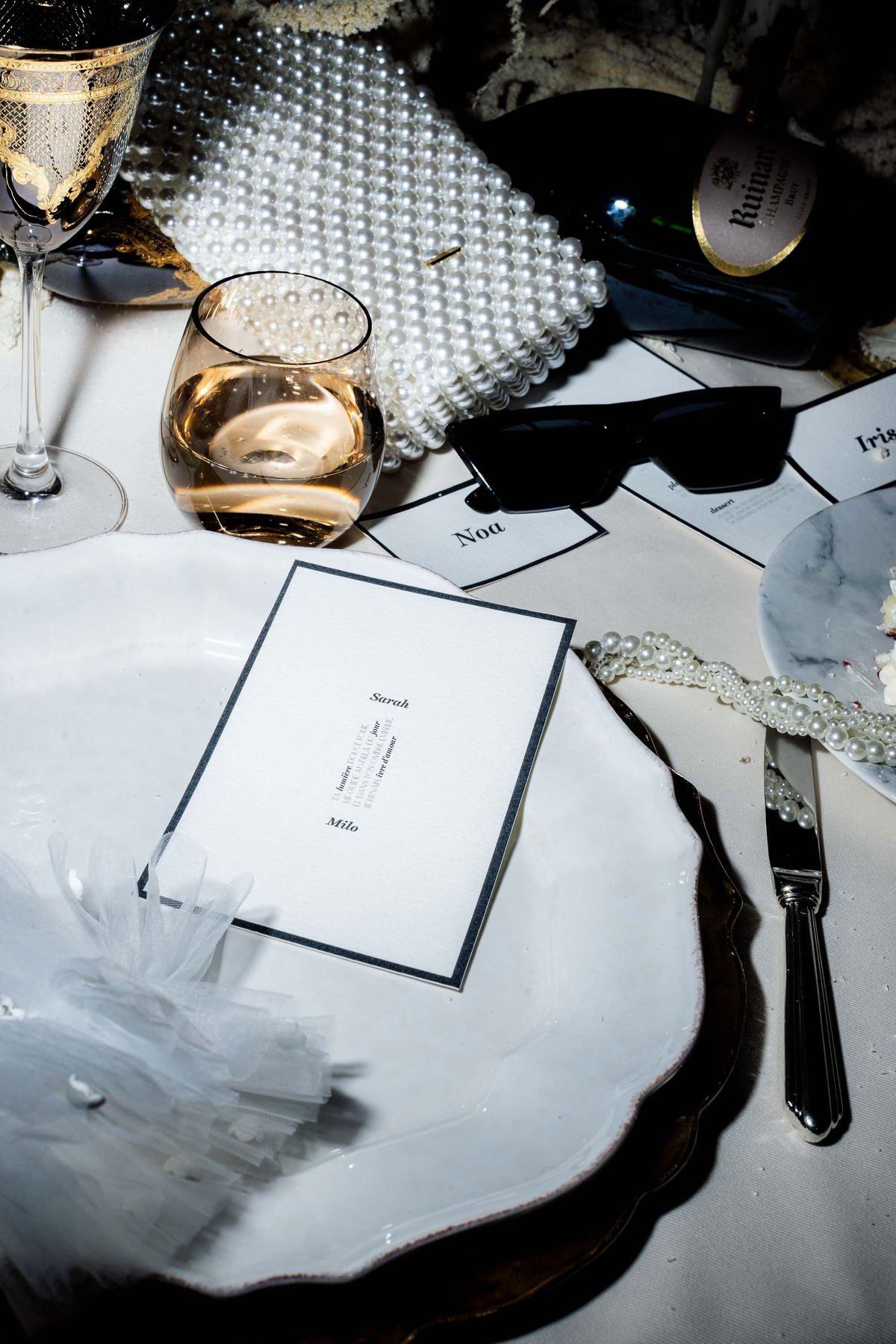 Overhead place setting with a menu card and oyster