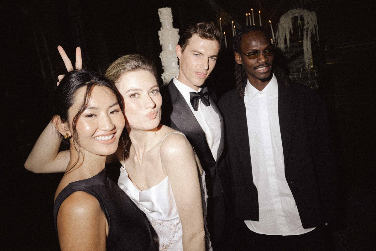 Wedding guests posing together at the evening celebration