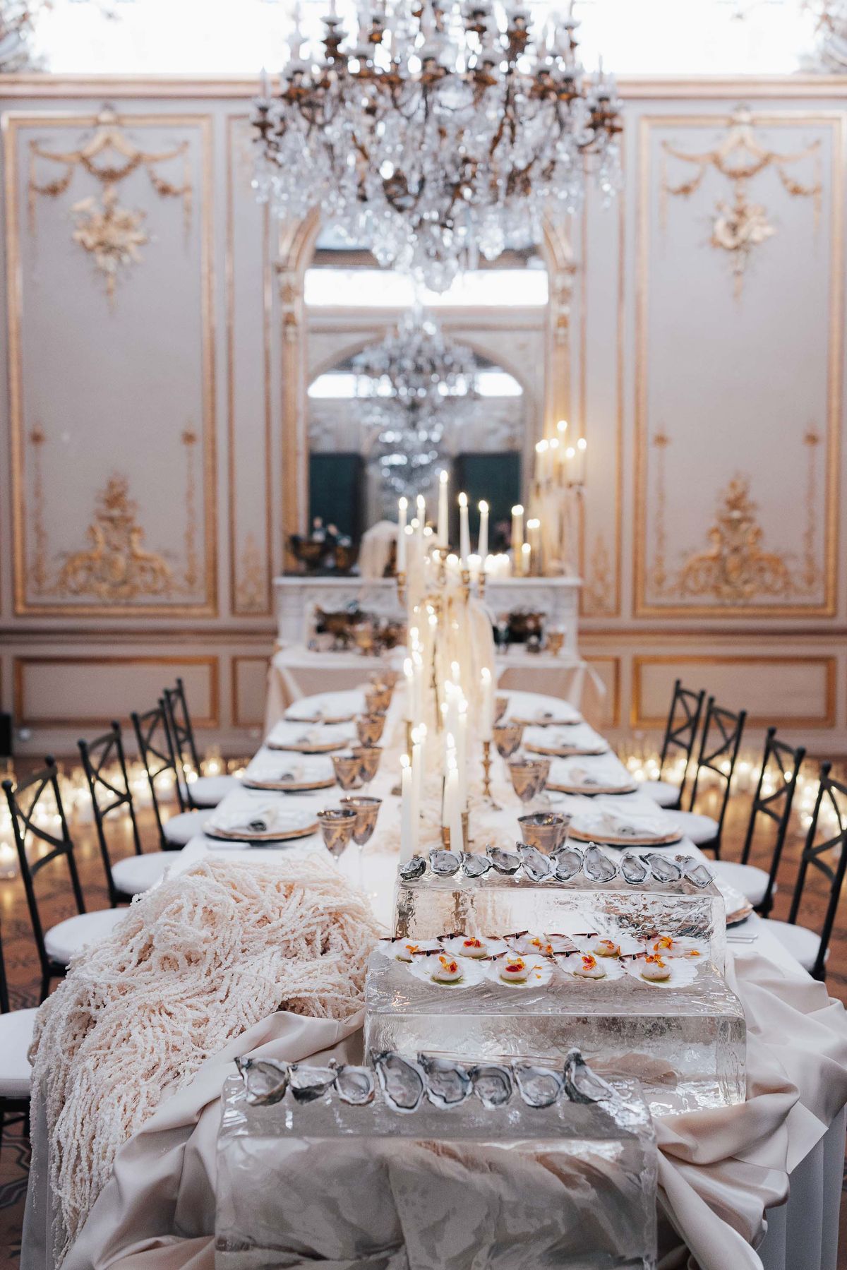 Long dinner table dressed with candles and candelabra at La Galerie Bourbon