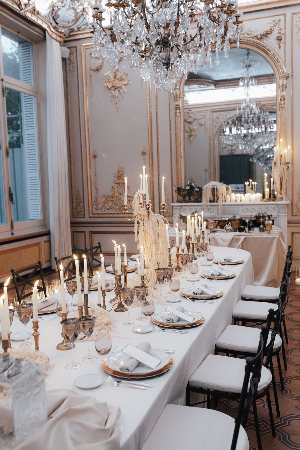 Monochromatic tablescape glowing with candlelight at La Galerie Bourbon