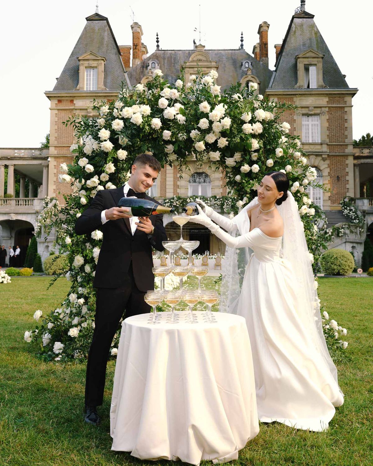 Wedding reception table setting with white roses