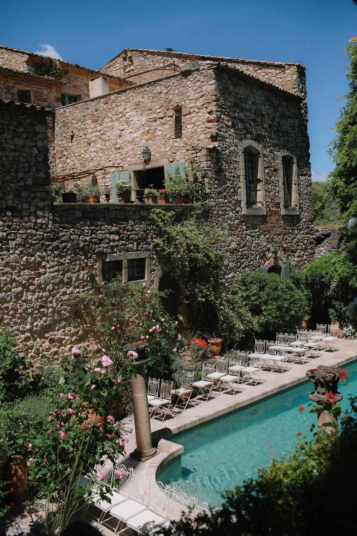 Ceremony area between pool and garden at Chateau St Victor Lacoste