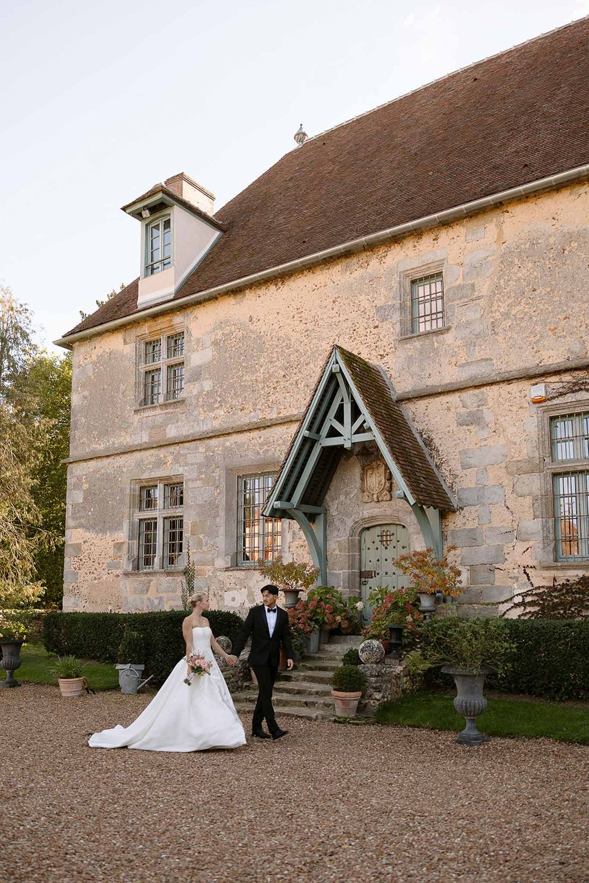 Bride and groom walking hand in hand