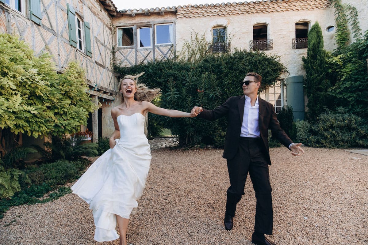 Bride and groom walking hand in hand