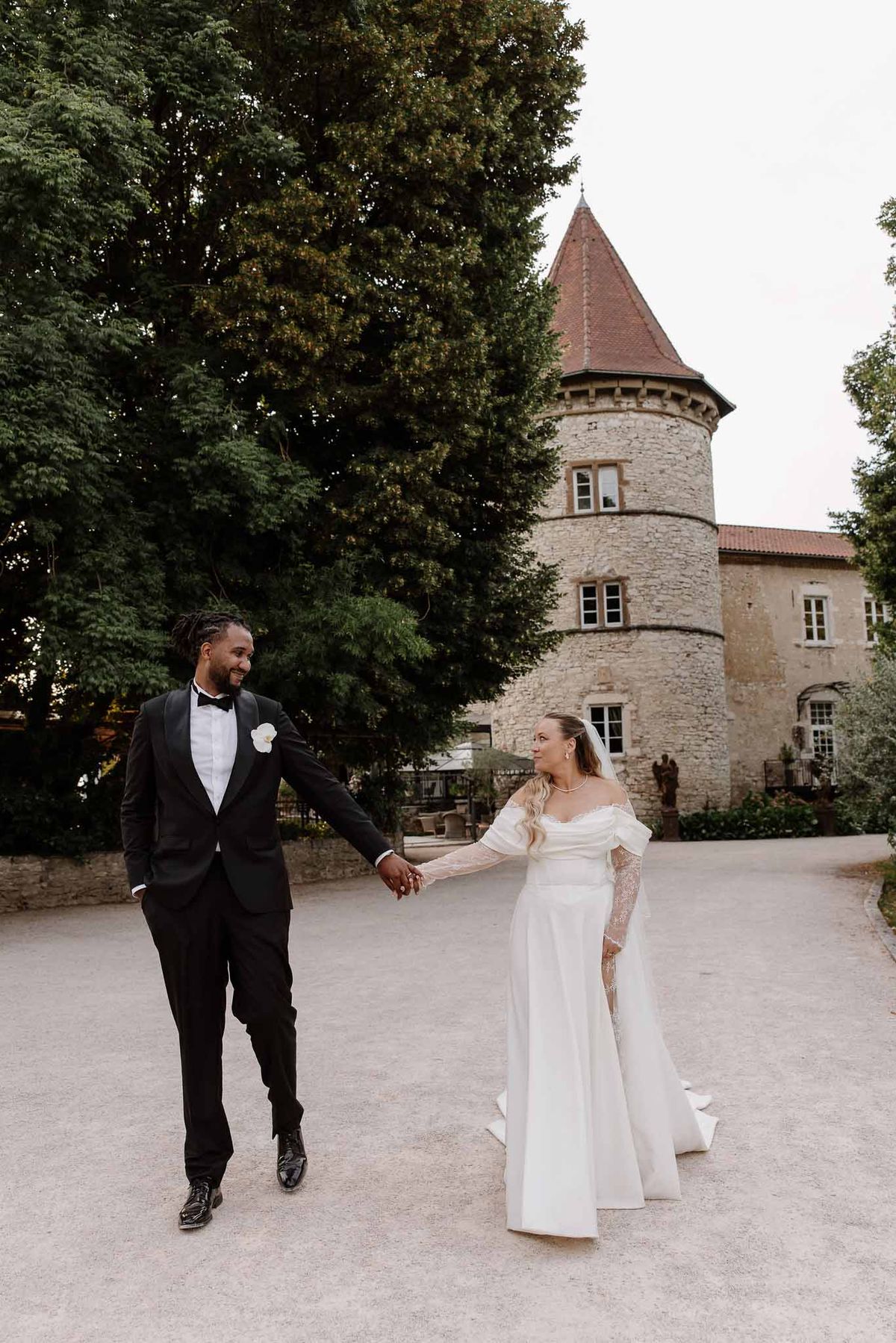 Bride and groom walking hand in hand