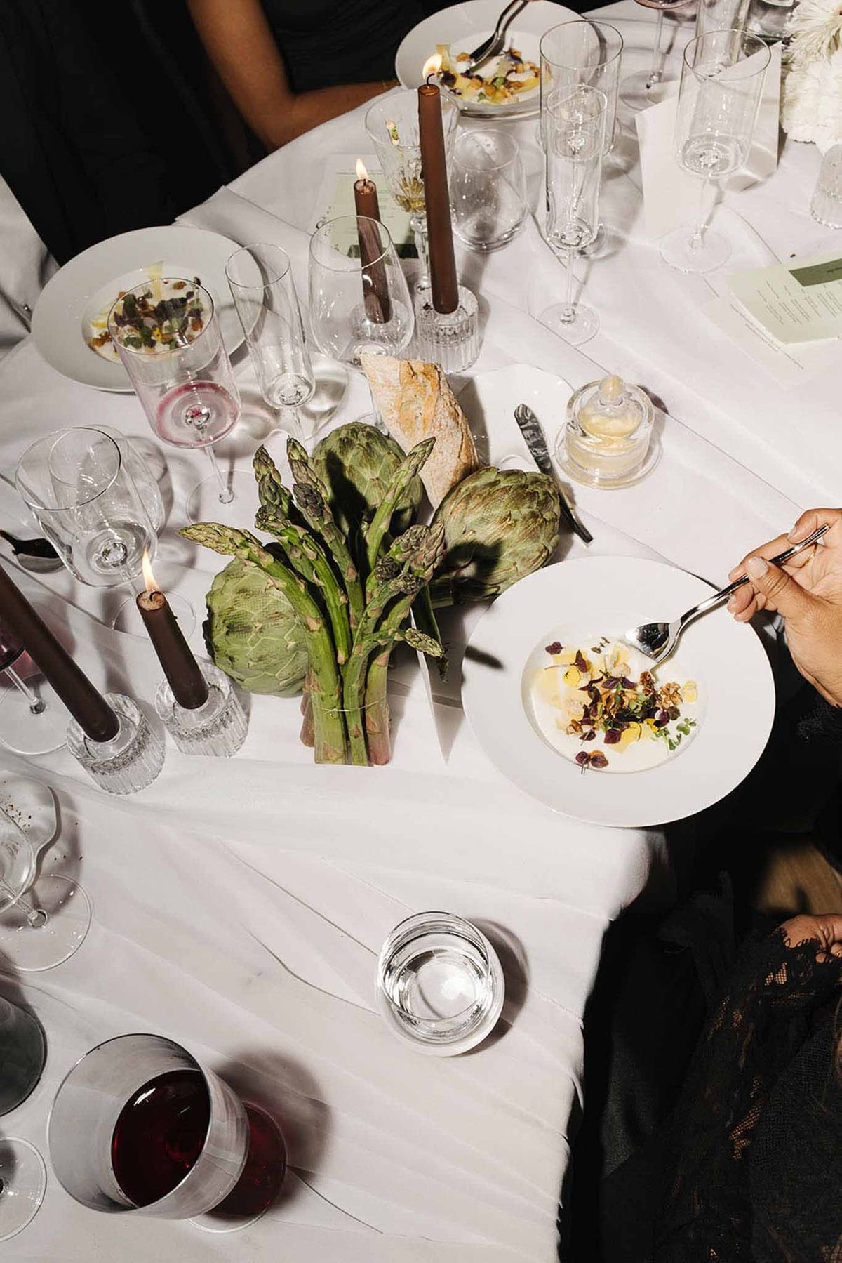 Wedding reception table setting with white roses