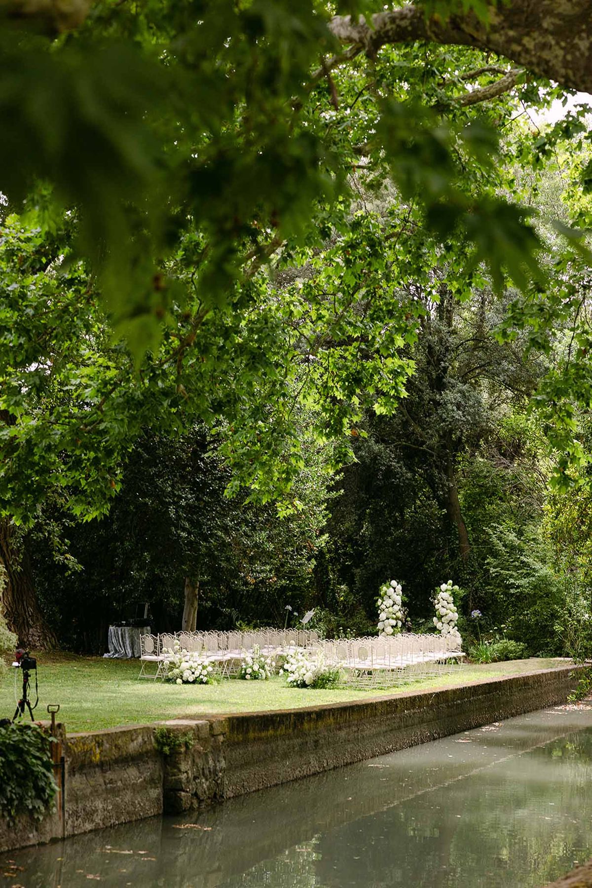 Wedding ceremony setup in a garden with white roses
