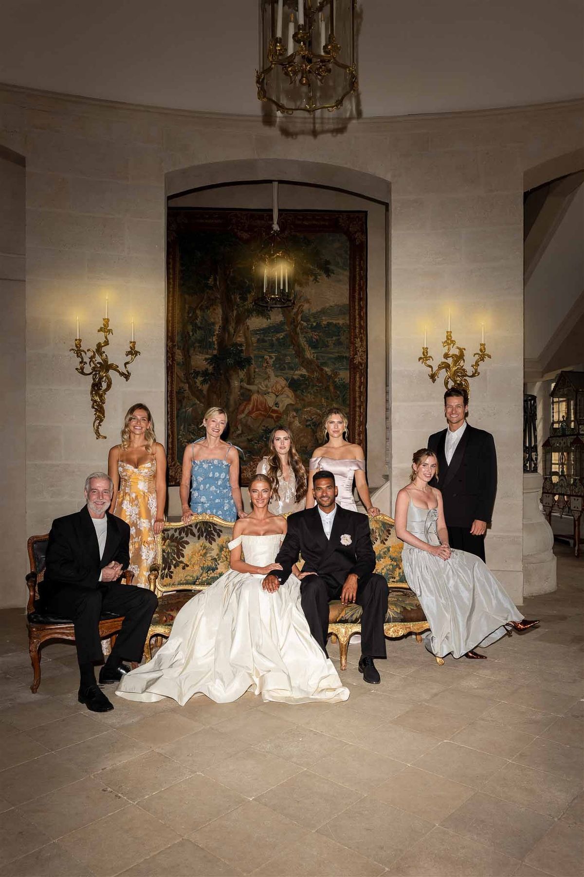 Formal bridal party portrait in grand hall at Chateau de Villette