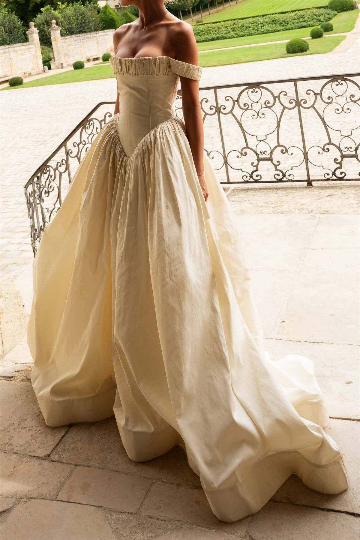 Bridal gown detail on balcony at Chateau de Villette