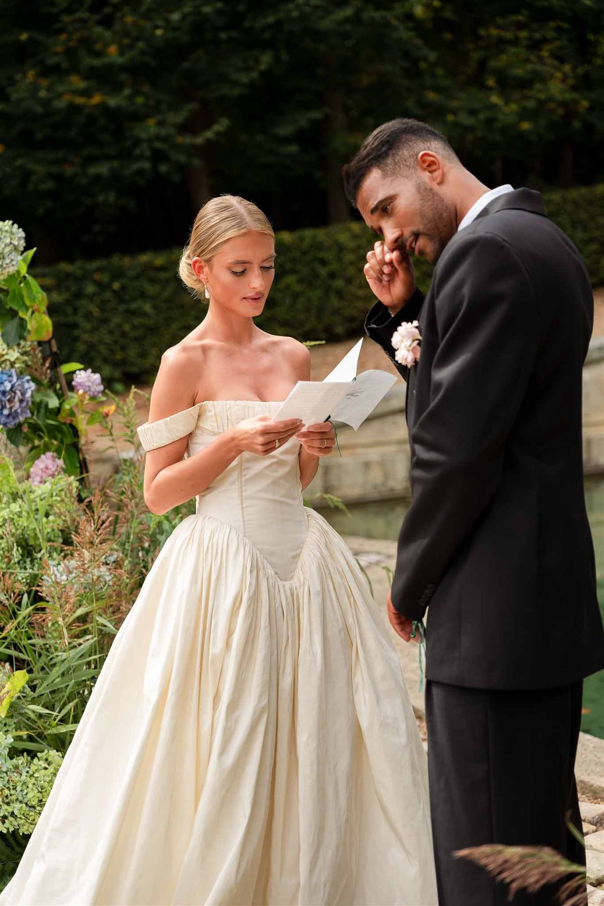 Bride reading vows during ceremony at Chateau de Villette