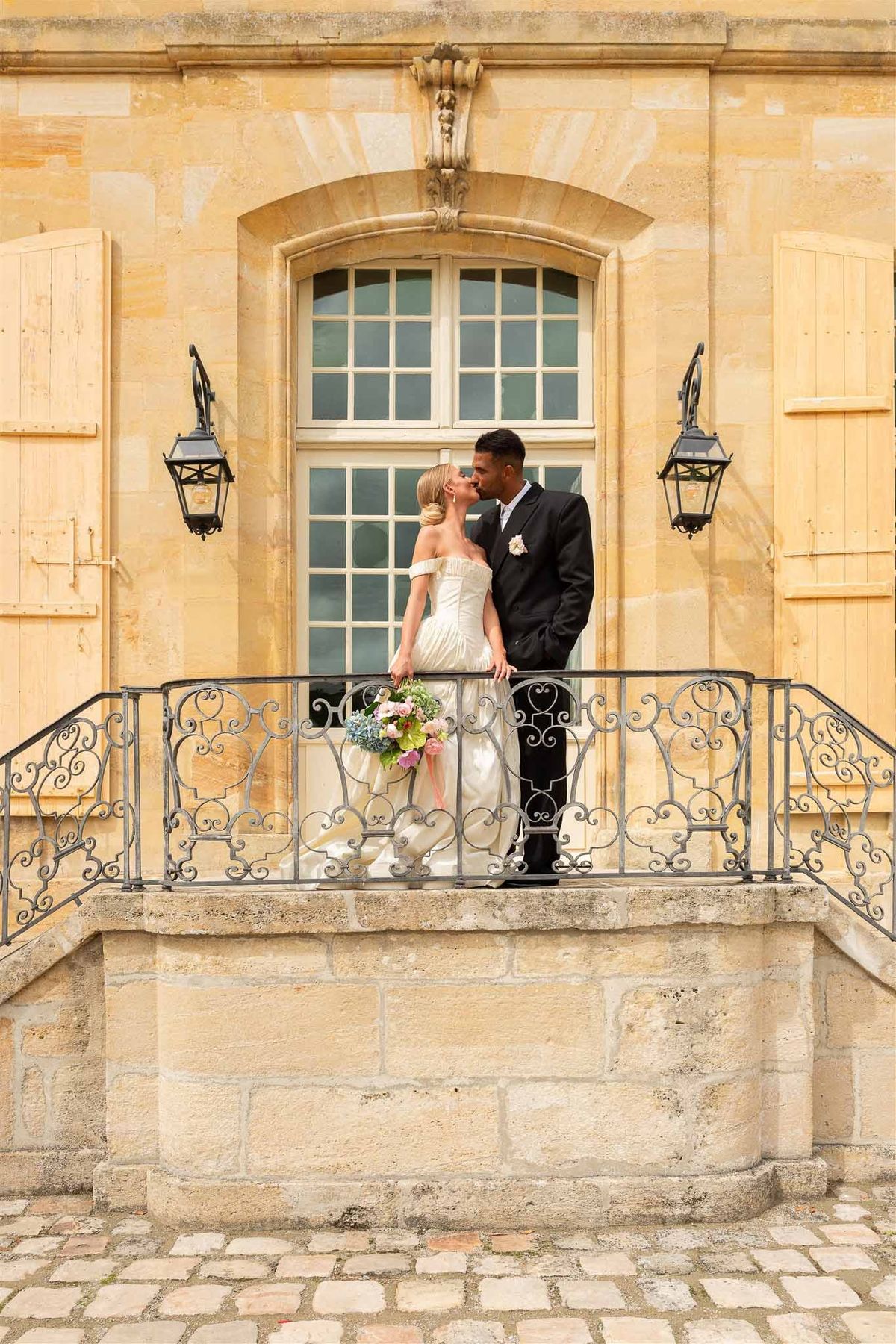 Couple on balcony at Chateau de Villette