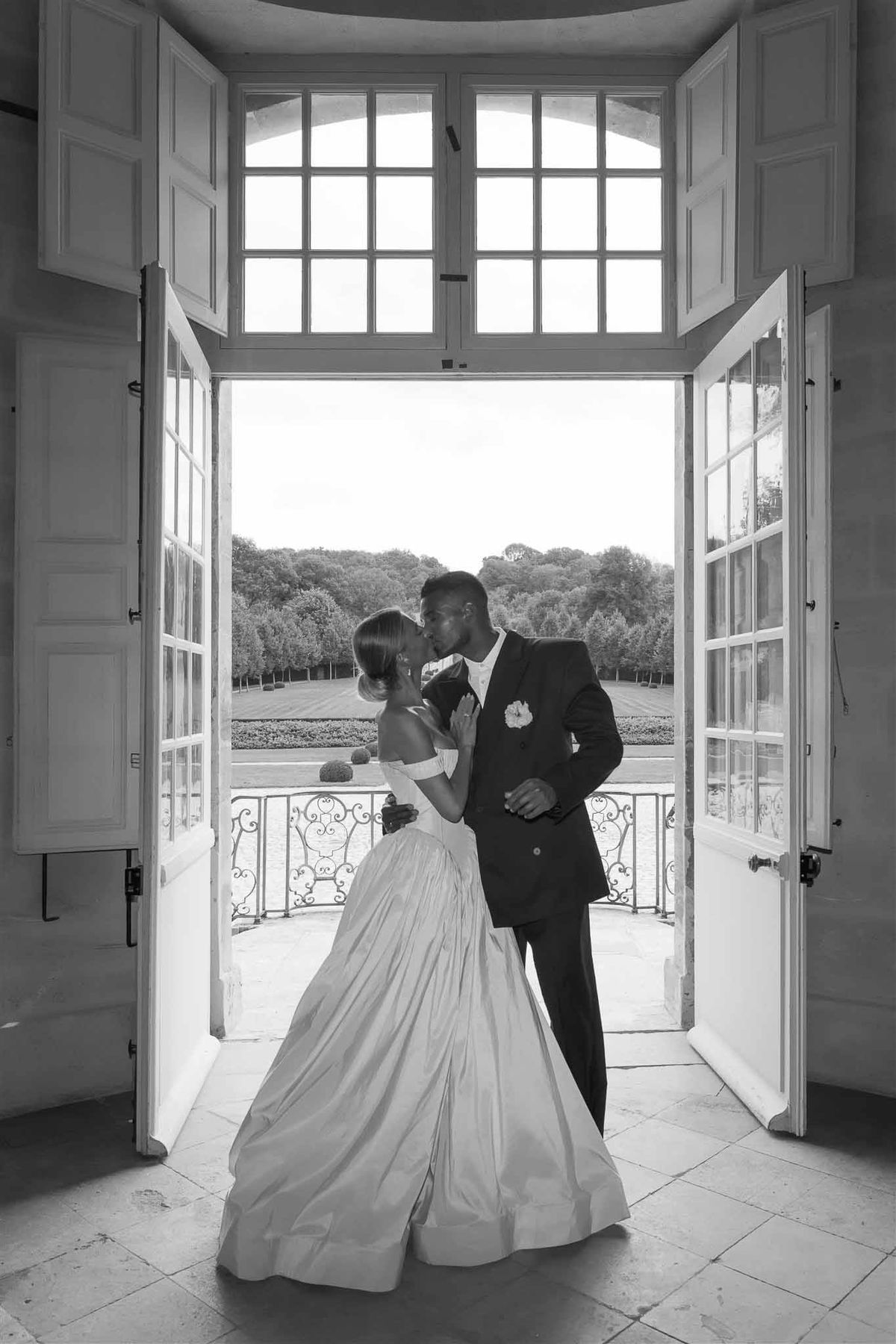 Couple in French doorway at Chateau de Villette black and white