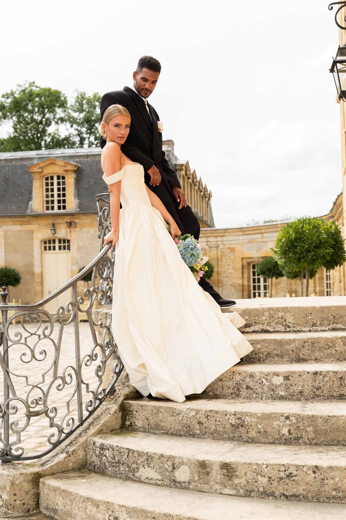 Couple on staircase at Chateau de Villette
