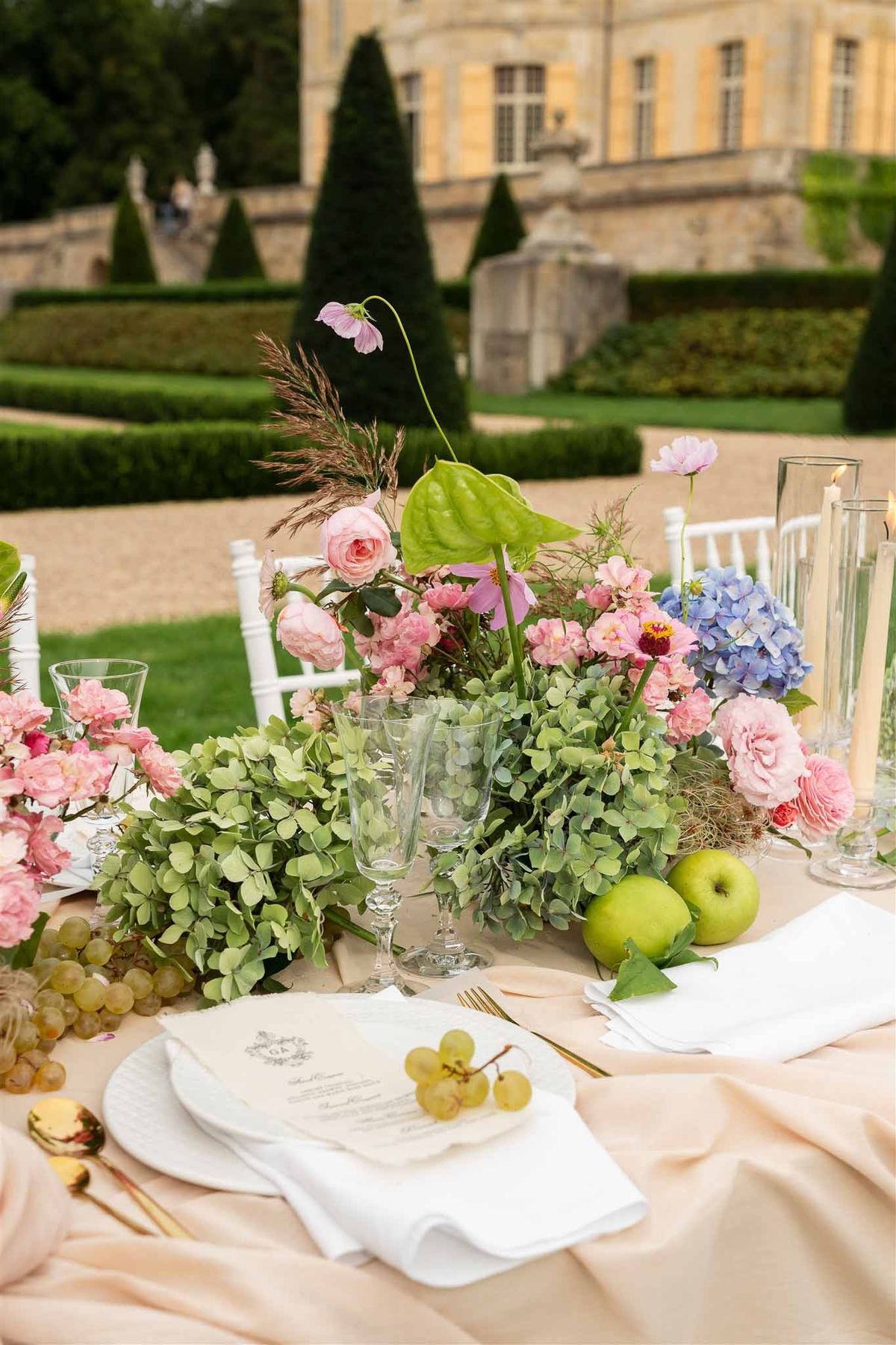 Garden centrepiece with chateau backdrop at Chateau de Villette