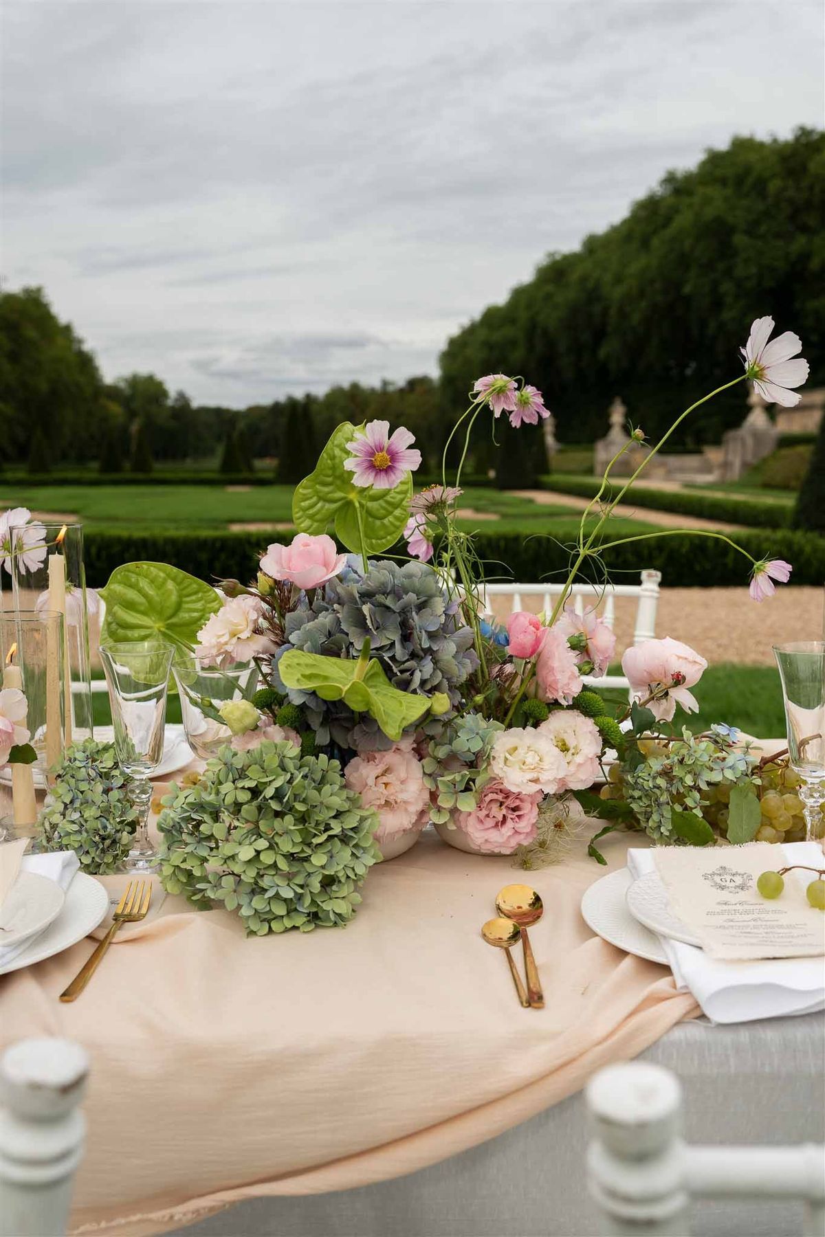 Organic floral centrepiece with garden view at Chateau de Villette