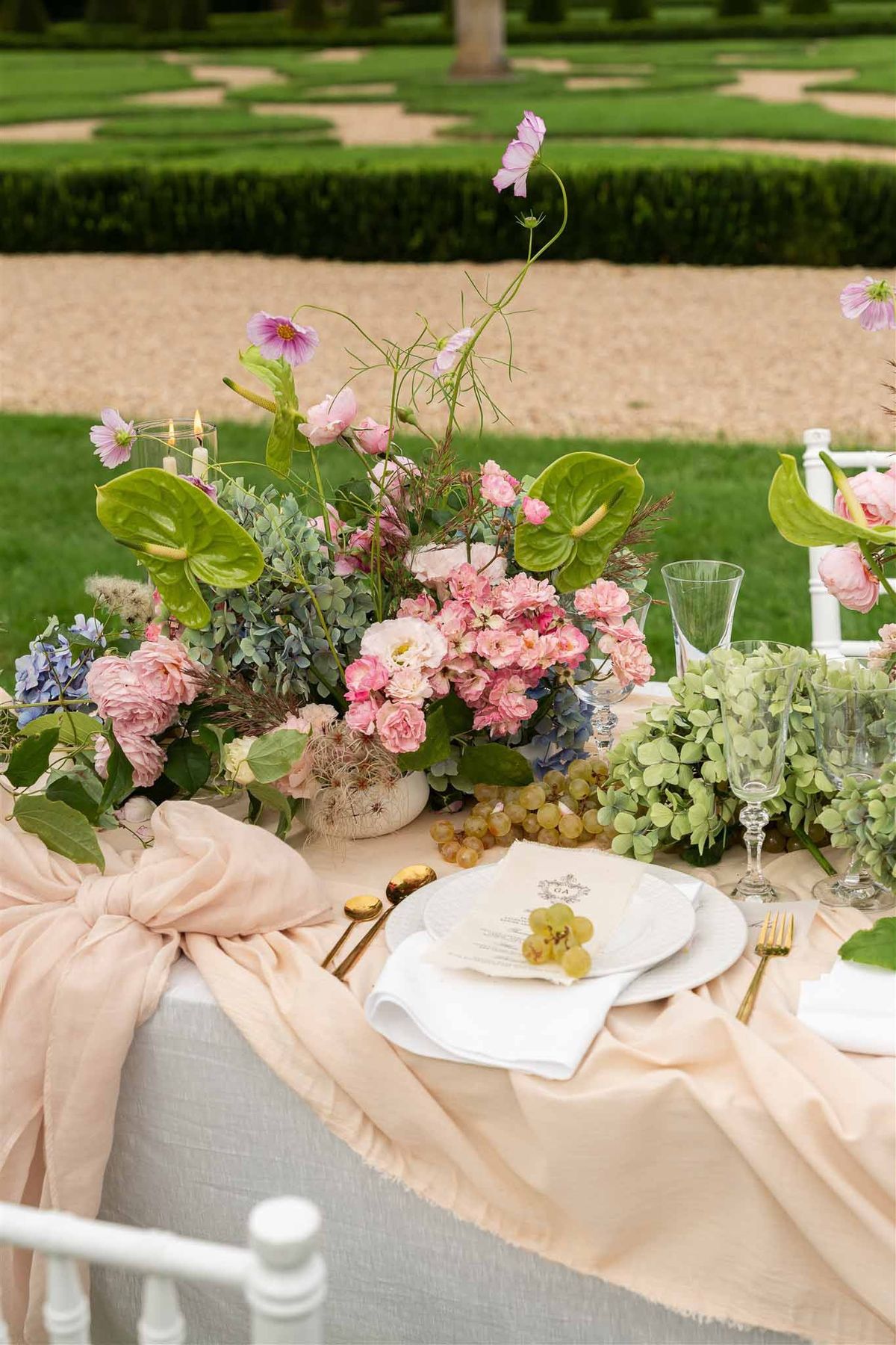 Place setting and floral centrepiece at Chateau de Villette
