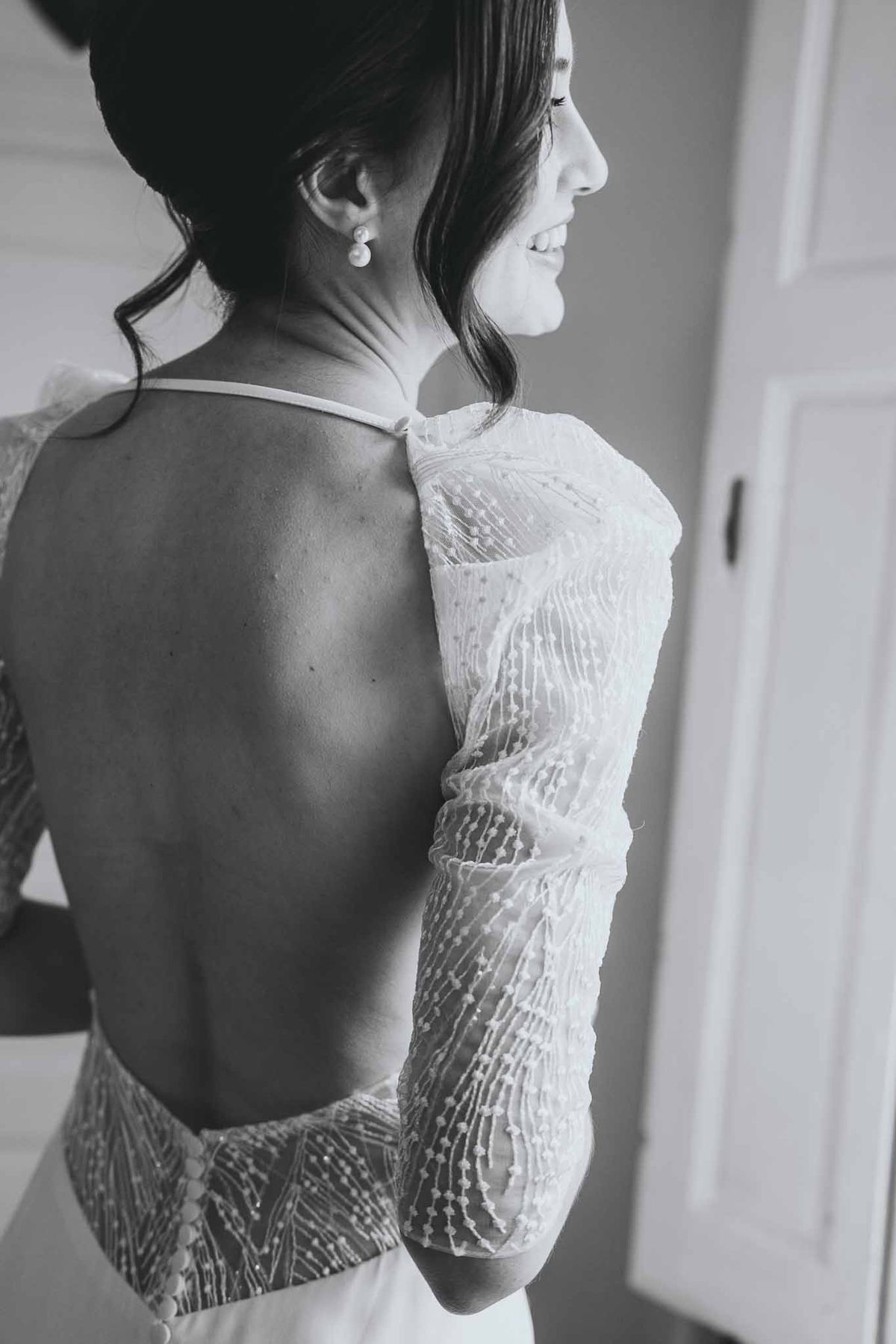 Full view of bride's sparkly open-back wedding dress