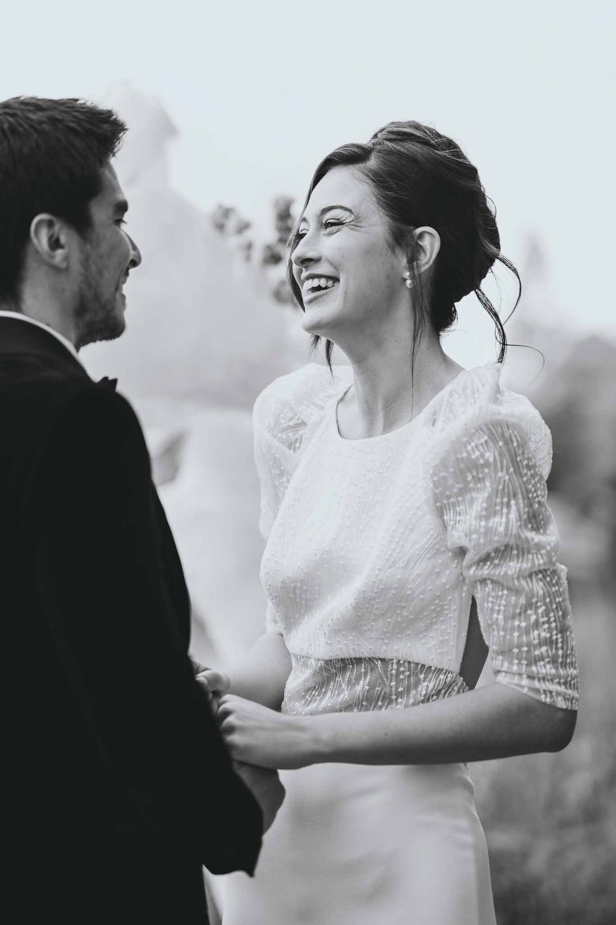 Close-up of couple's hands held together during ceremony at Chateau d'Arcelot