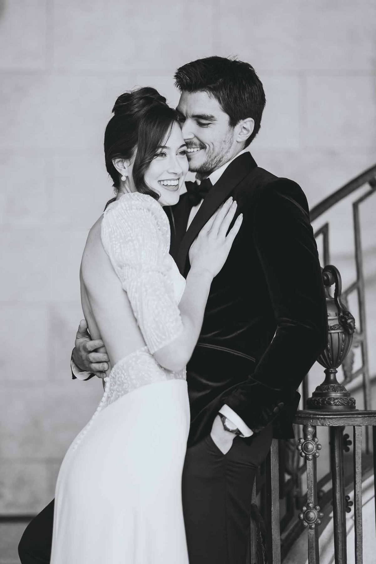 Close-up portrait of couple embracing on chateau staircase