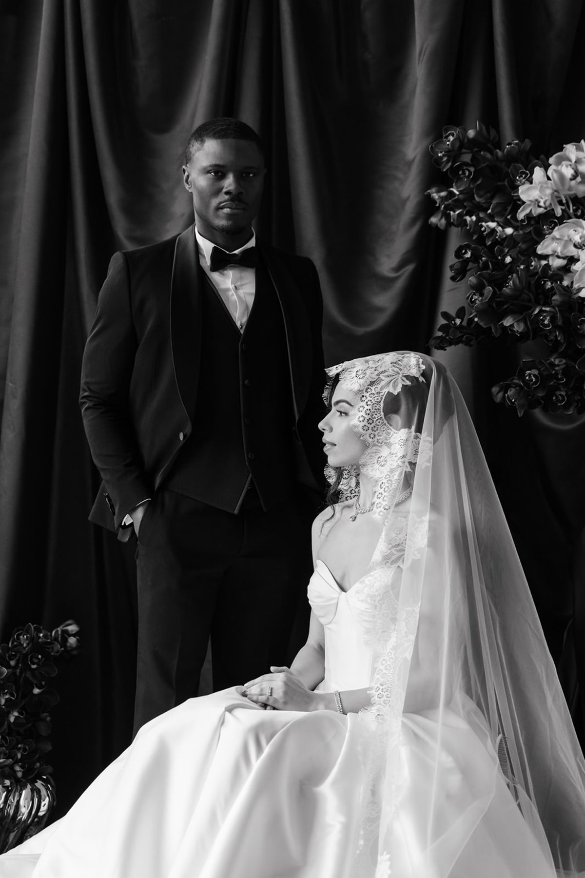 Close-up formal couple portrait with lace veil at Domaine des Halles in black and white