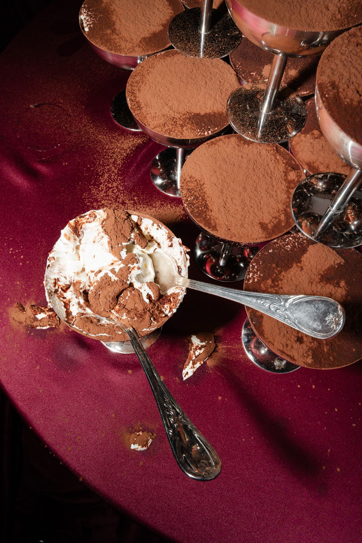 Tiramisu desserts in coupe glasses on burgundy linen at Domaine des Halles wedding